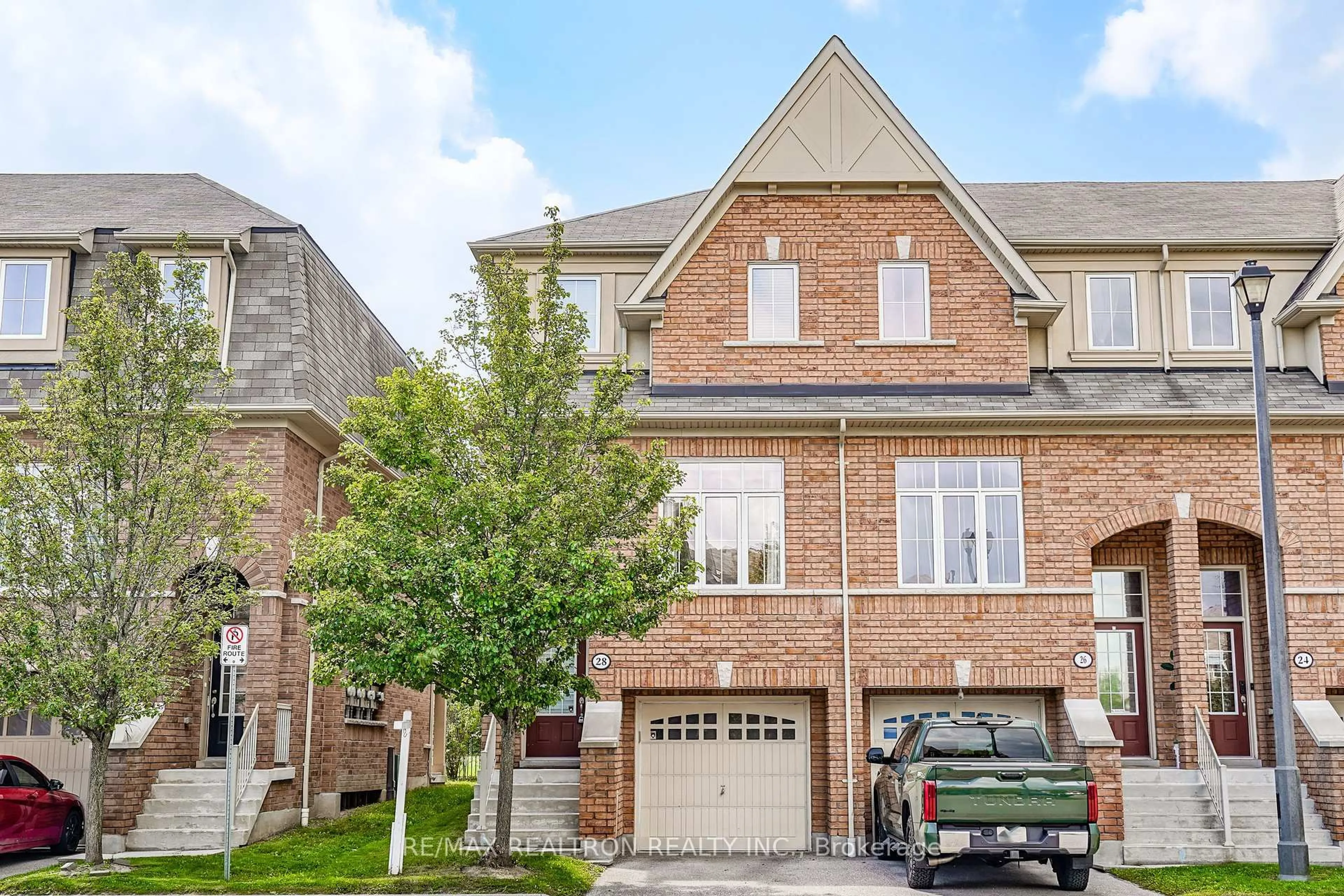 Home with brick exterior material, street for 28 Burtonbury Lane, Ajax Ontario L1Z 0L3