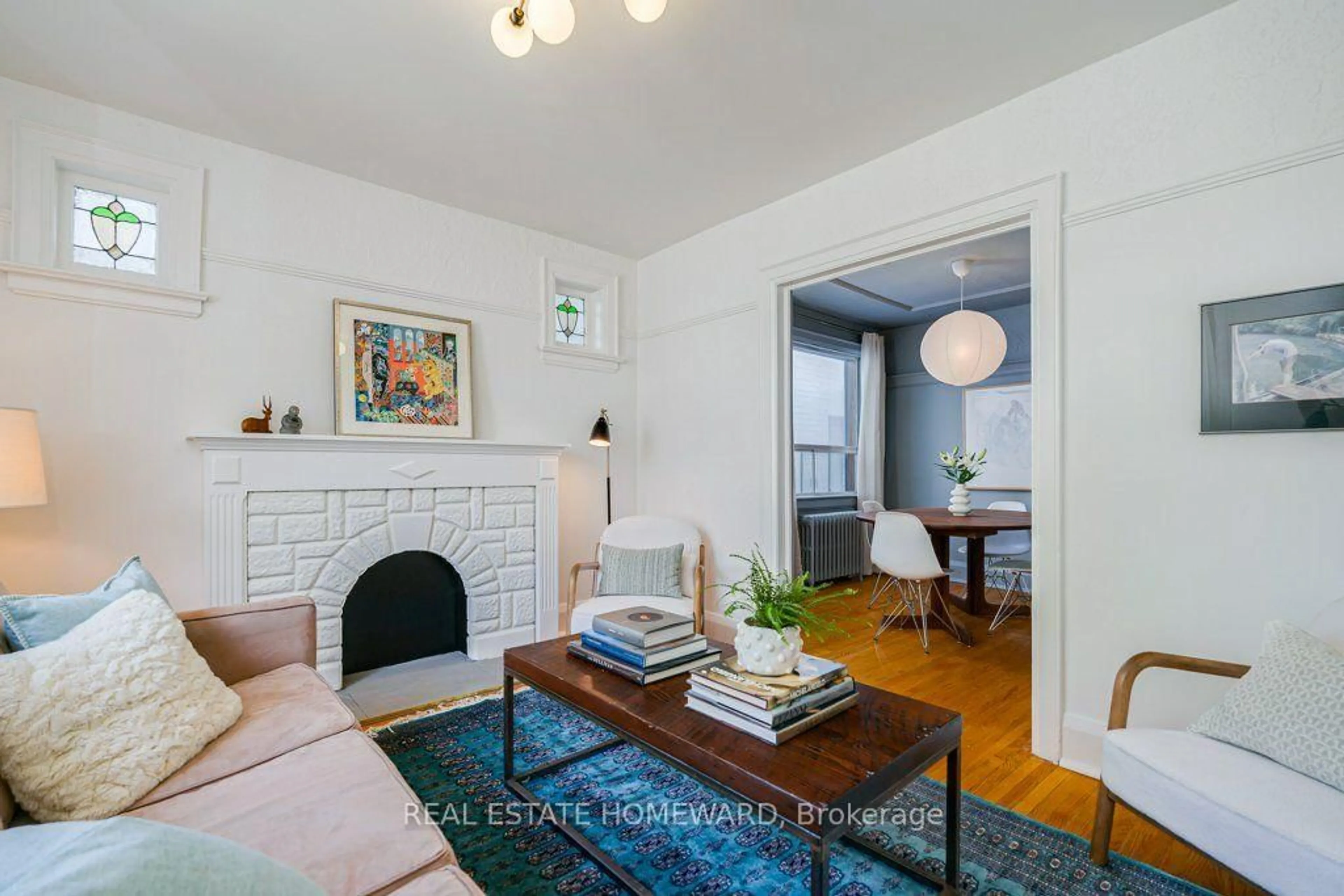 Living room with furniture, wood/laminate floor for 94 Wiley Ave, Toronto Ontario M4J 3W6
