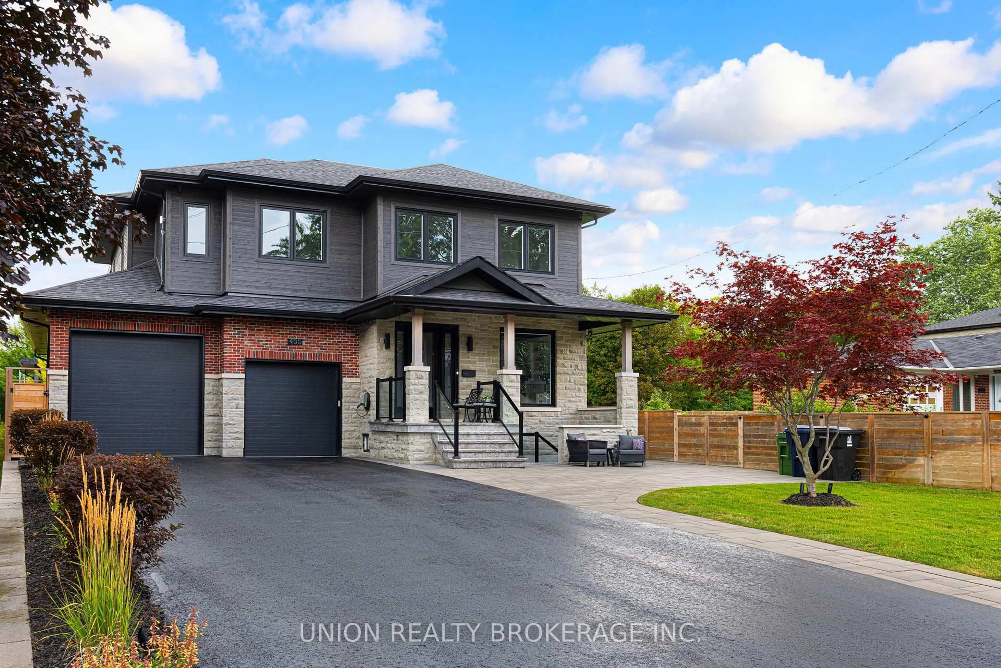 Home with brick exterior material, street for 400 Rouge Hills Dr, Toronto Ontario M1C 2Z5