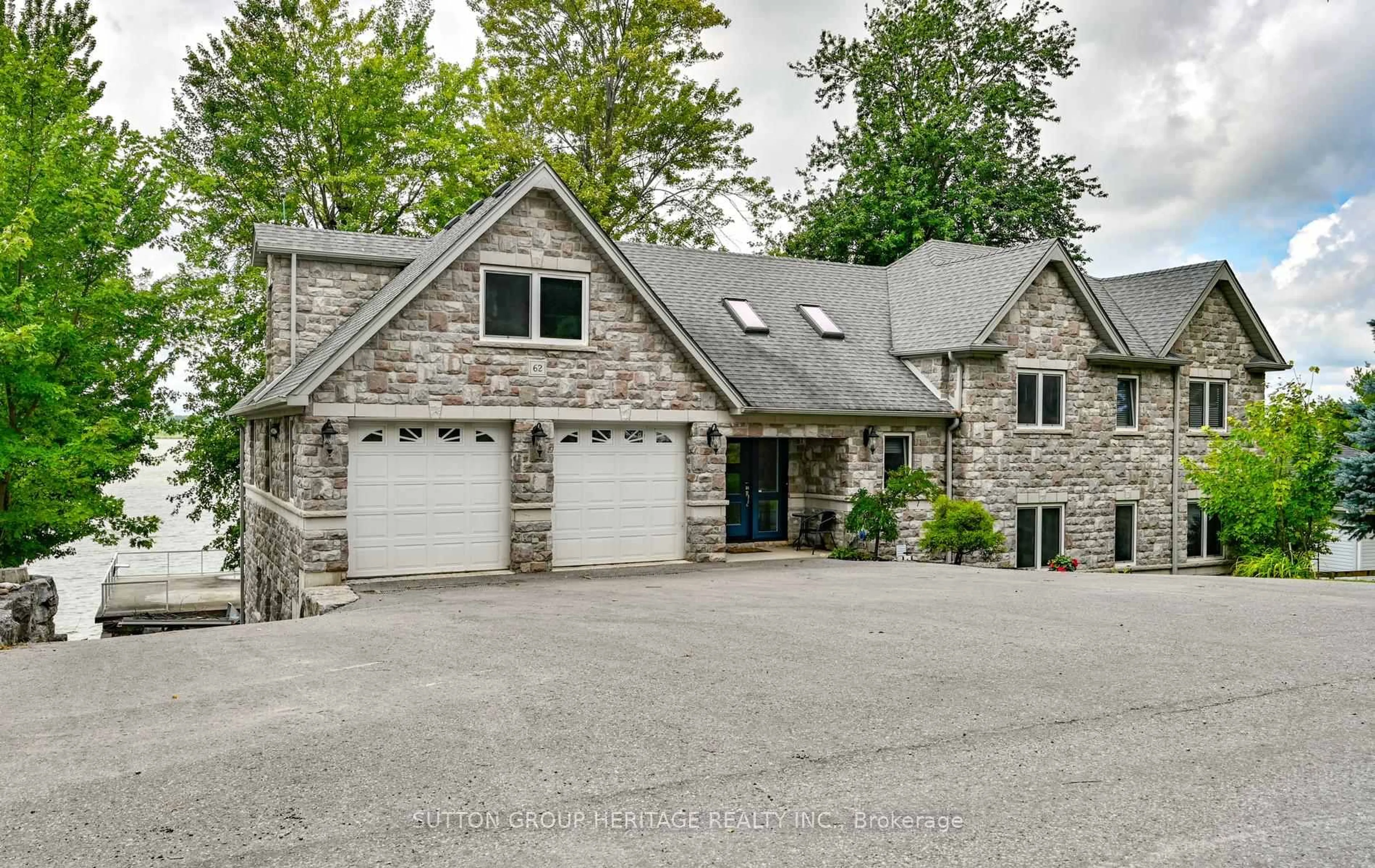 Home with brick exterior material, street for 62 Lakeside Beach Rd, Scugog Ontario L9L 1B4