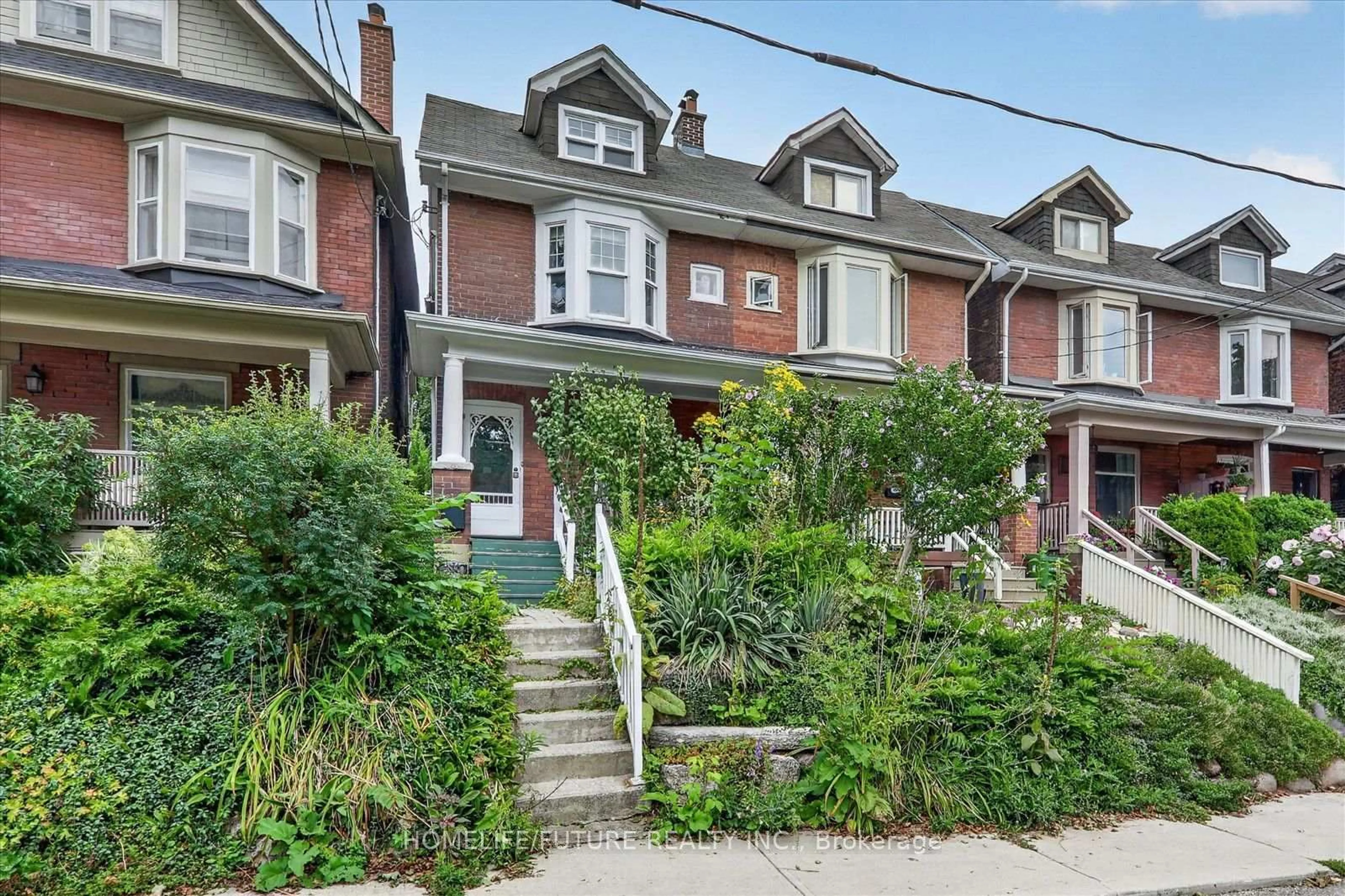 Home with brick exterior material, street for 56 Sparkhall Ave, Toronto Ontario M4K 1G6