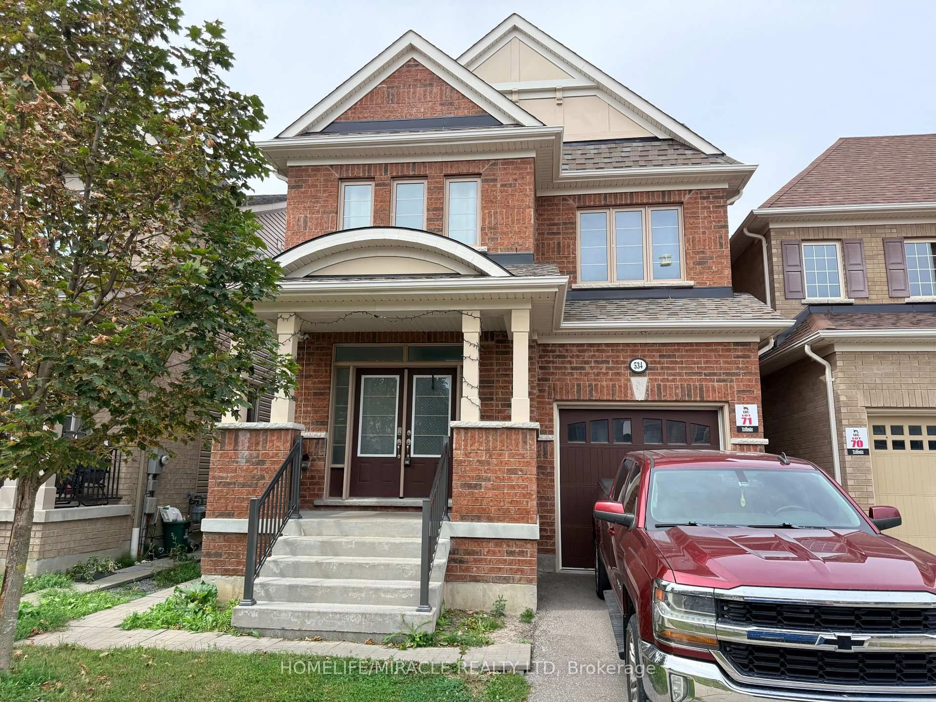 Home with brick exterior material, street for 534 Windfields Farm Dr, Oshawa Ontario L1L 0L8