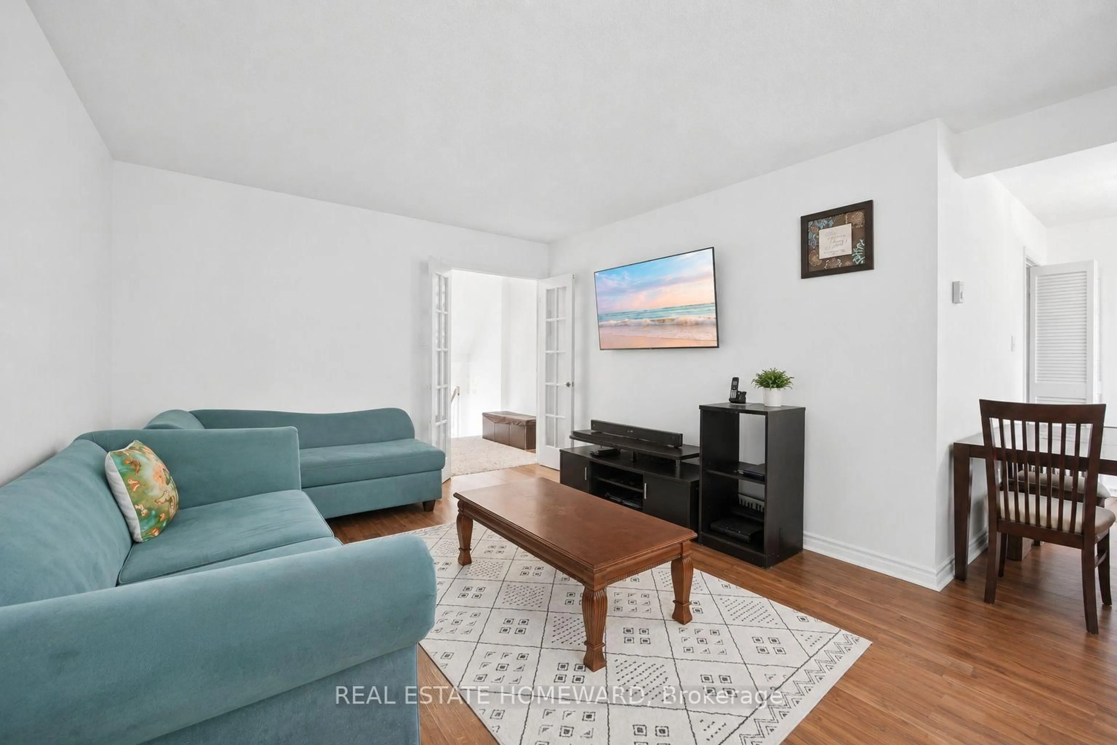 Living room with furniture, wood/laminate floor for 1360 Glenanna Rd #17A, Pickering Ontario L1V 2T5