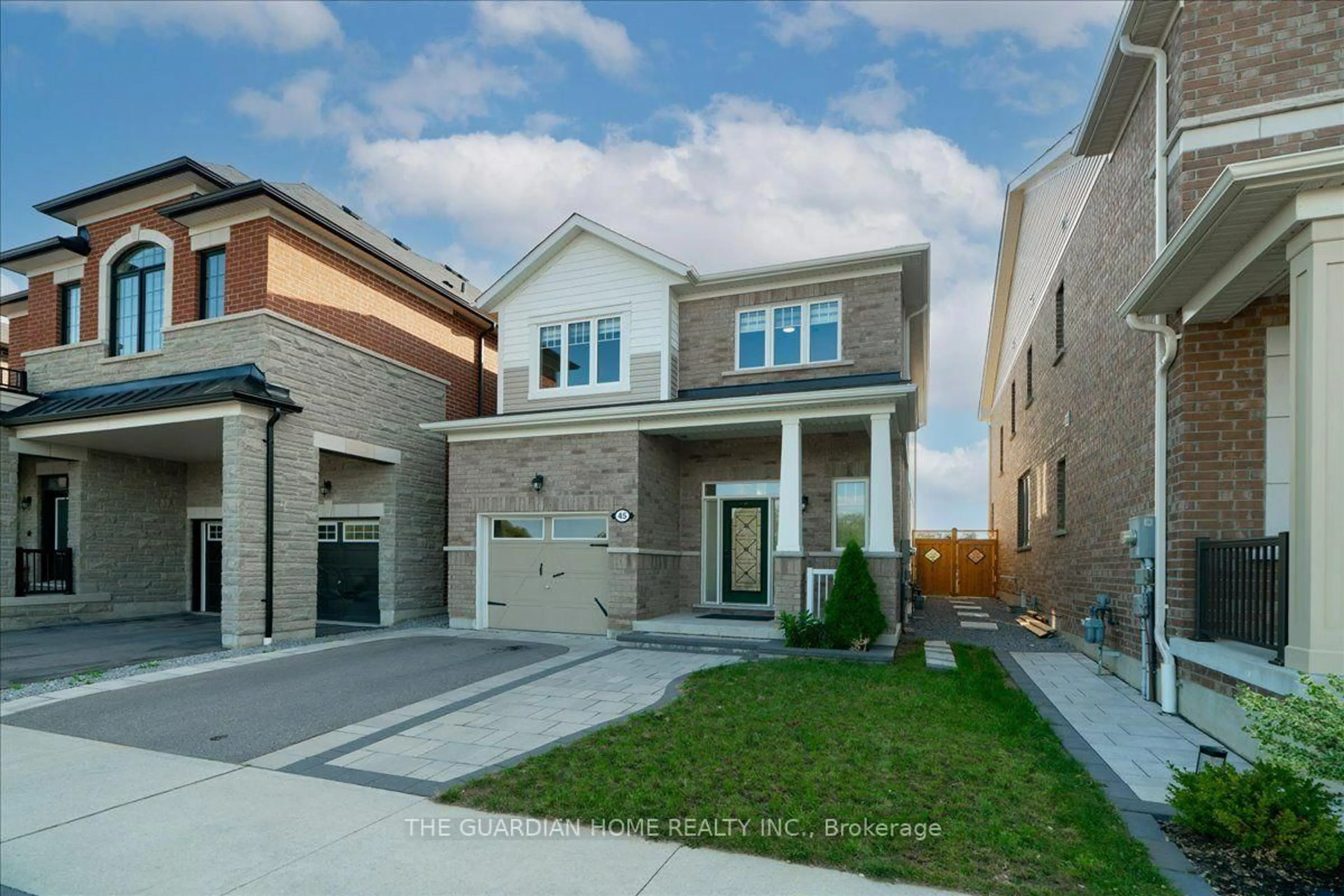 Home with brick exterior material, street for 45 Barkerville Dr, Whitby Ontario L1P 0M4