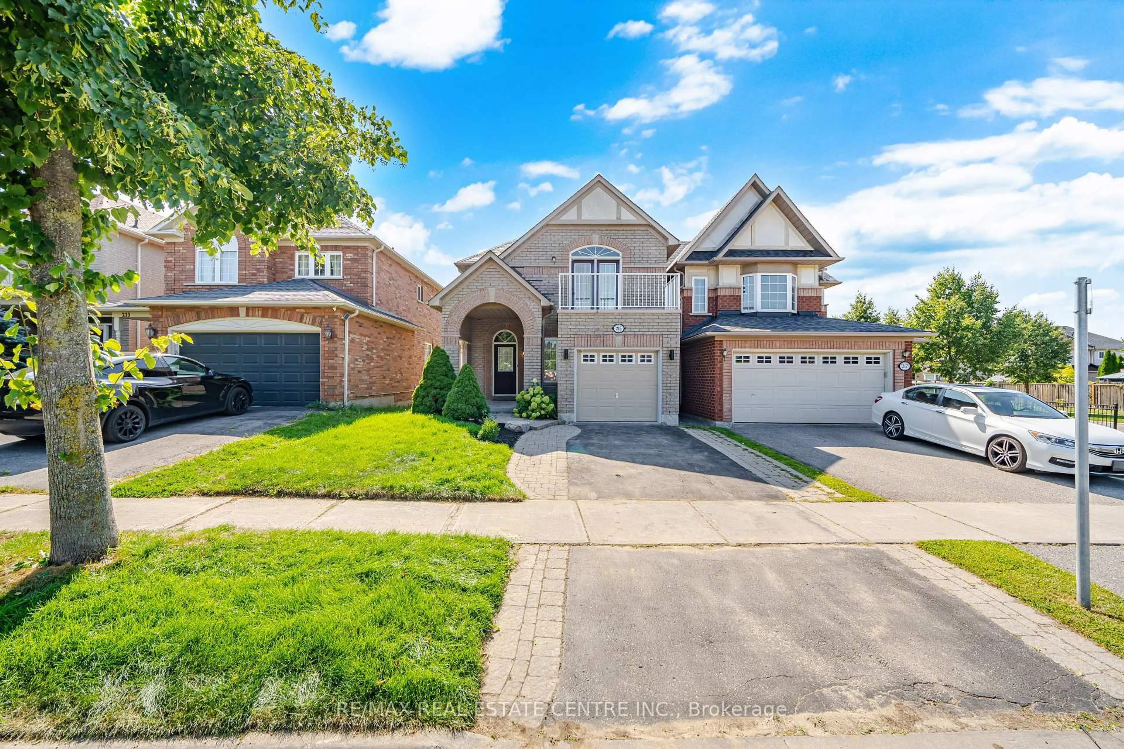 Home with brick exterior material, street for 215 Willowbrook Dr, Whitby Ontario L1R 2Y7