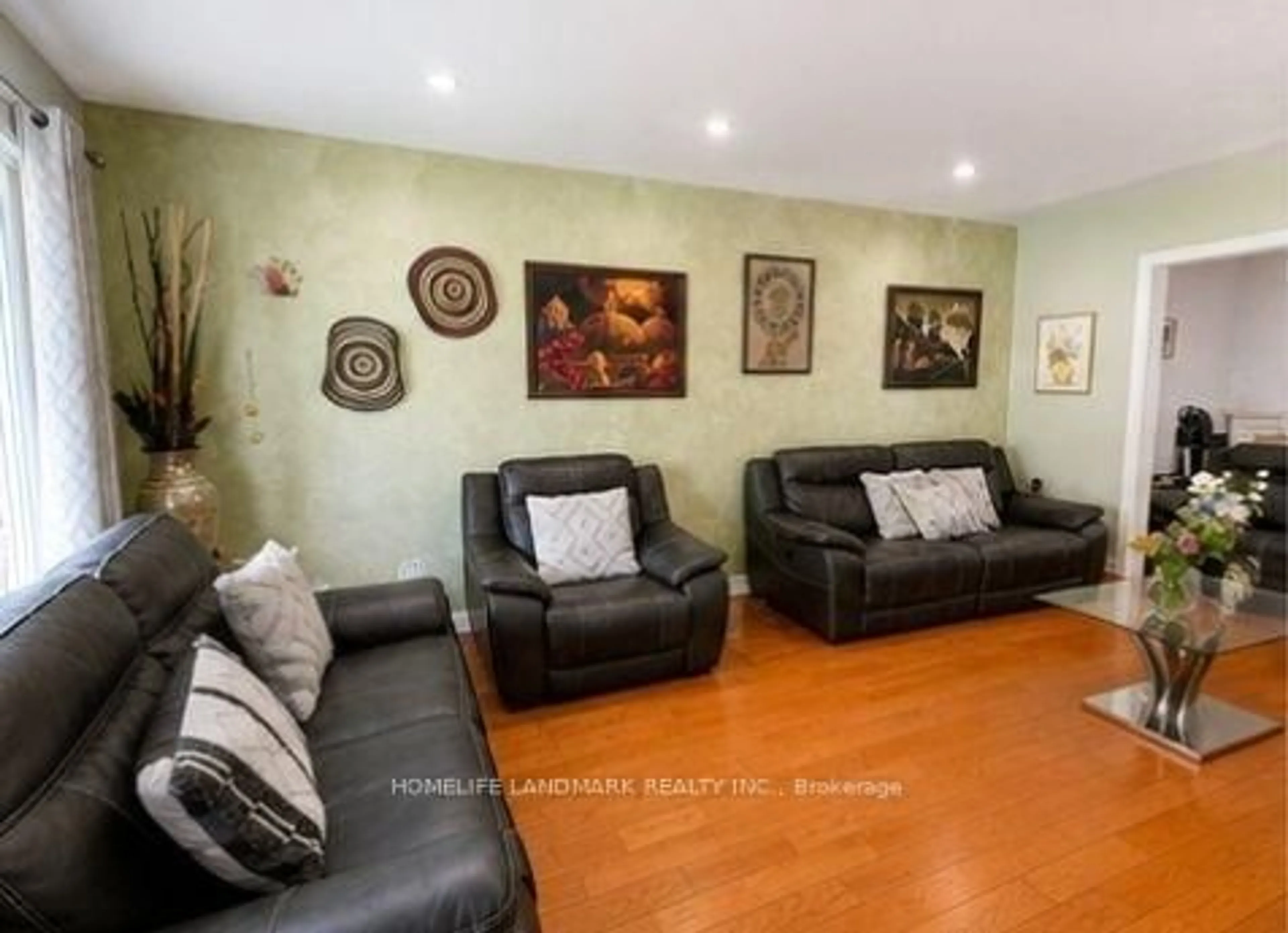 Living room with furniture, wood/laminate floor for 5 Collingsbrook Blvd, Toronto Ontario M1W 1L5