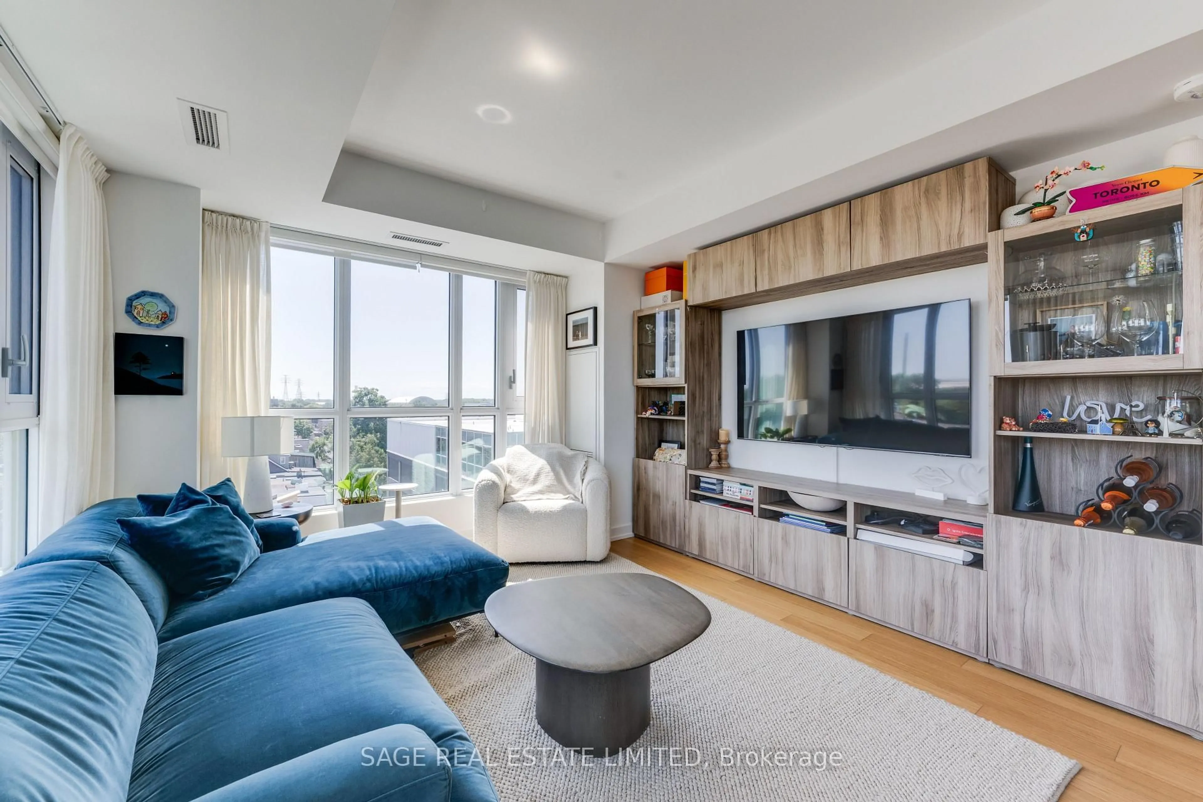 Living room with furniture, unknown for 150 Logan Ave #734, Toronto Ontario M4M 0E4