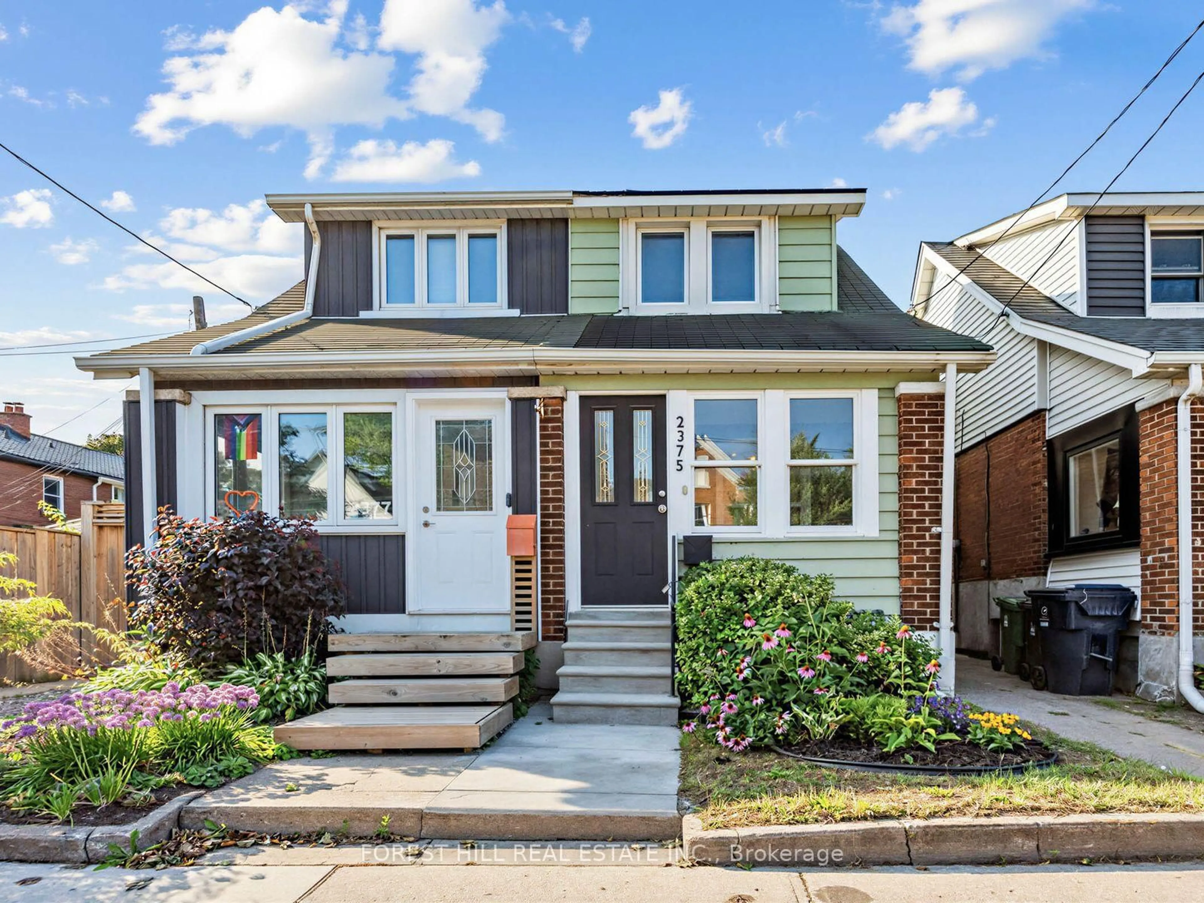 Home with vinyl exterior material, street for 2375 Gerrard St, Toronto Ontario M4E 2E7