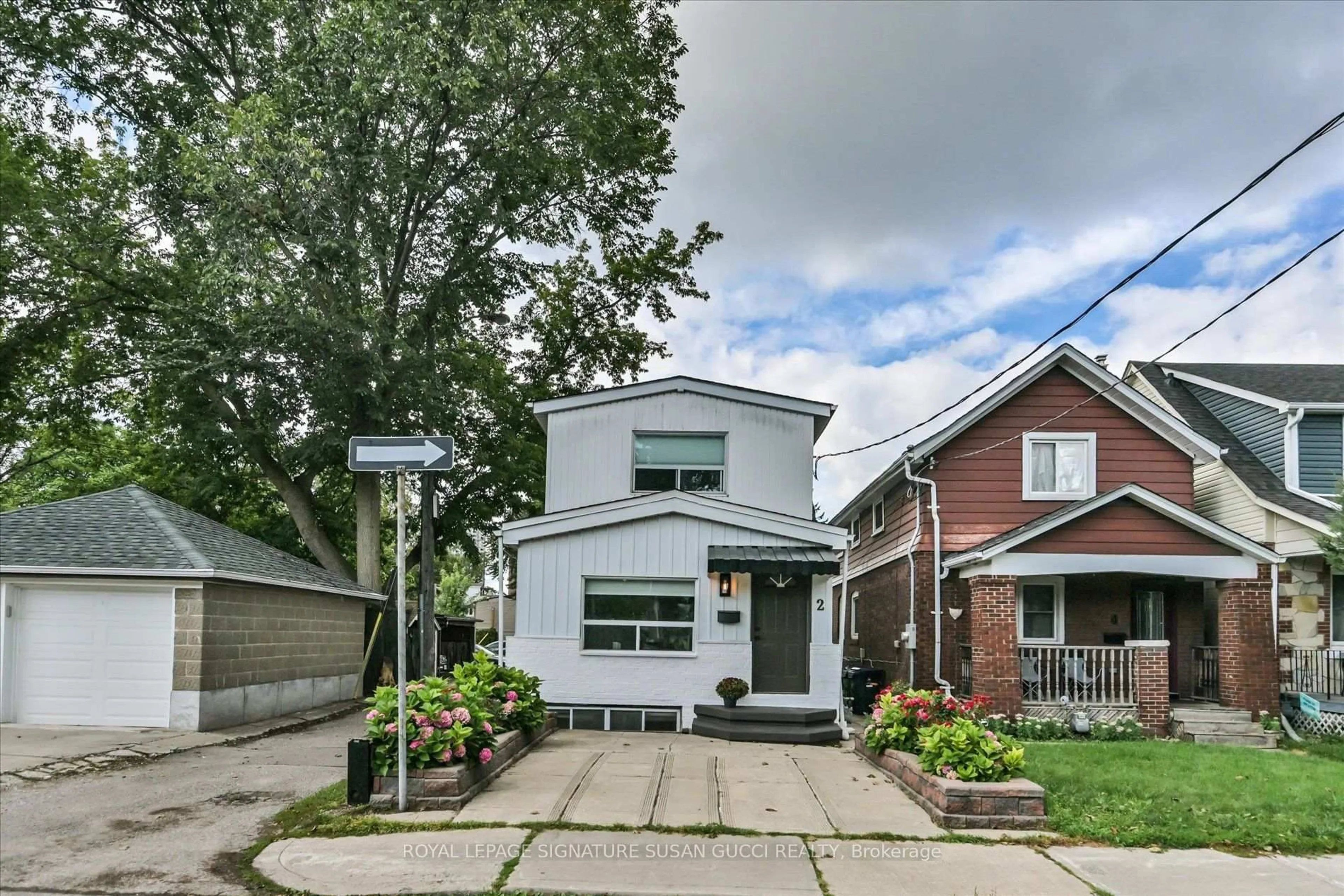 Home with brick exterior material, street for 2 Sutherland Ave, Toronto Ontario M4C 1R9