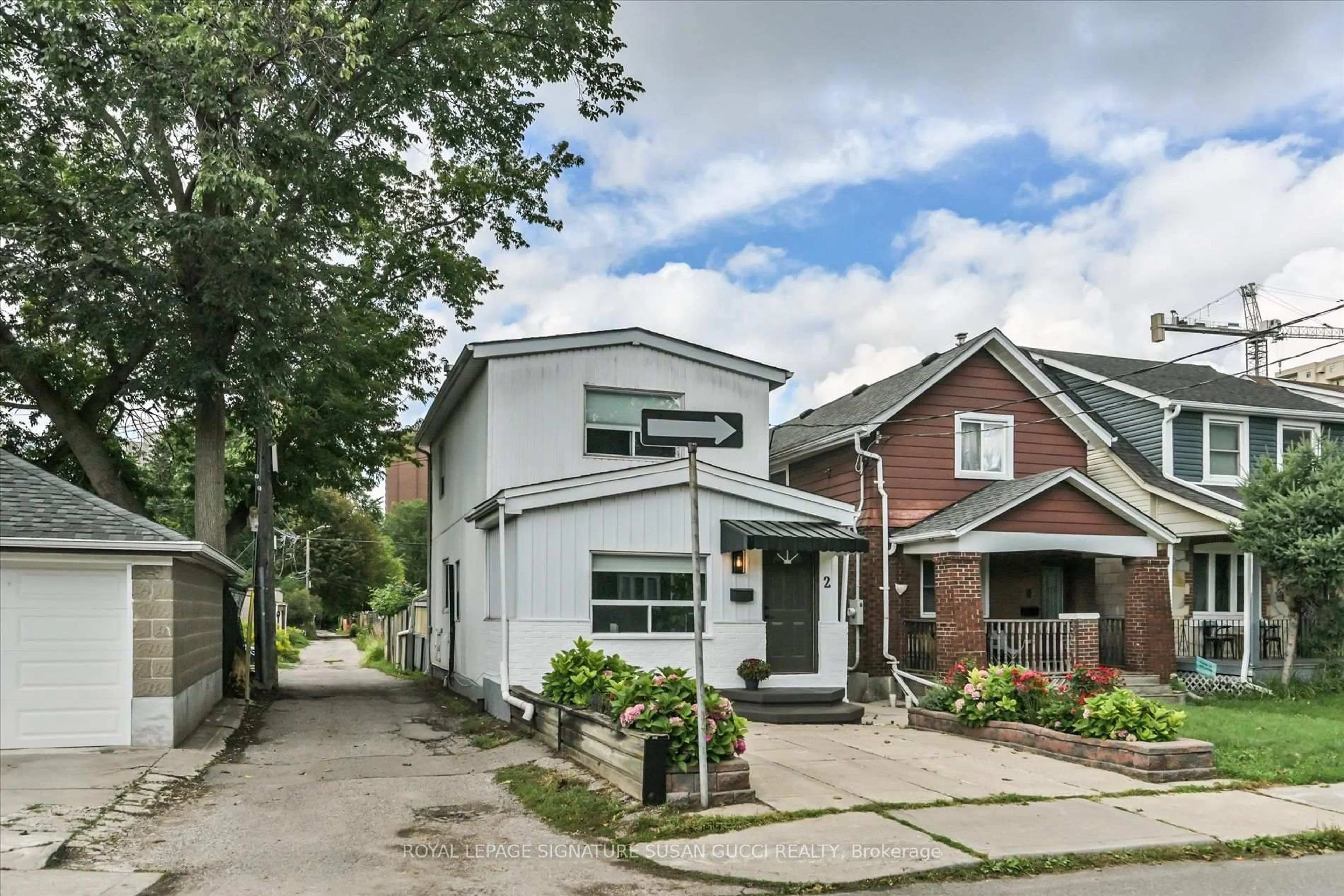 Home with brick exterior material, street for 2 Sutherland Ave, Toronto Ontario M4C 1R9