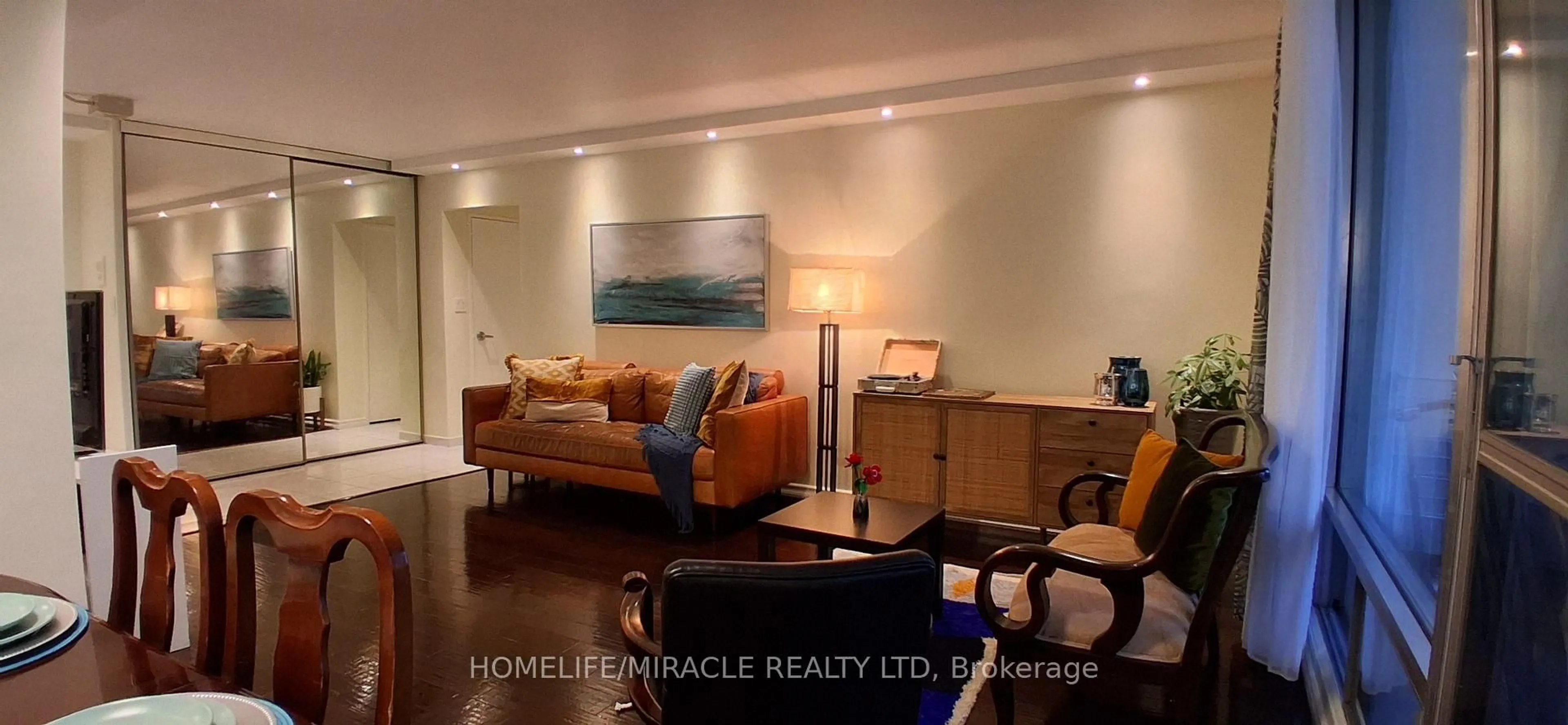 Living room with furniture, wood/laminate floor for 1 Massey Sq #1618, Toronto Ontario M4C 5L4