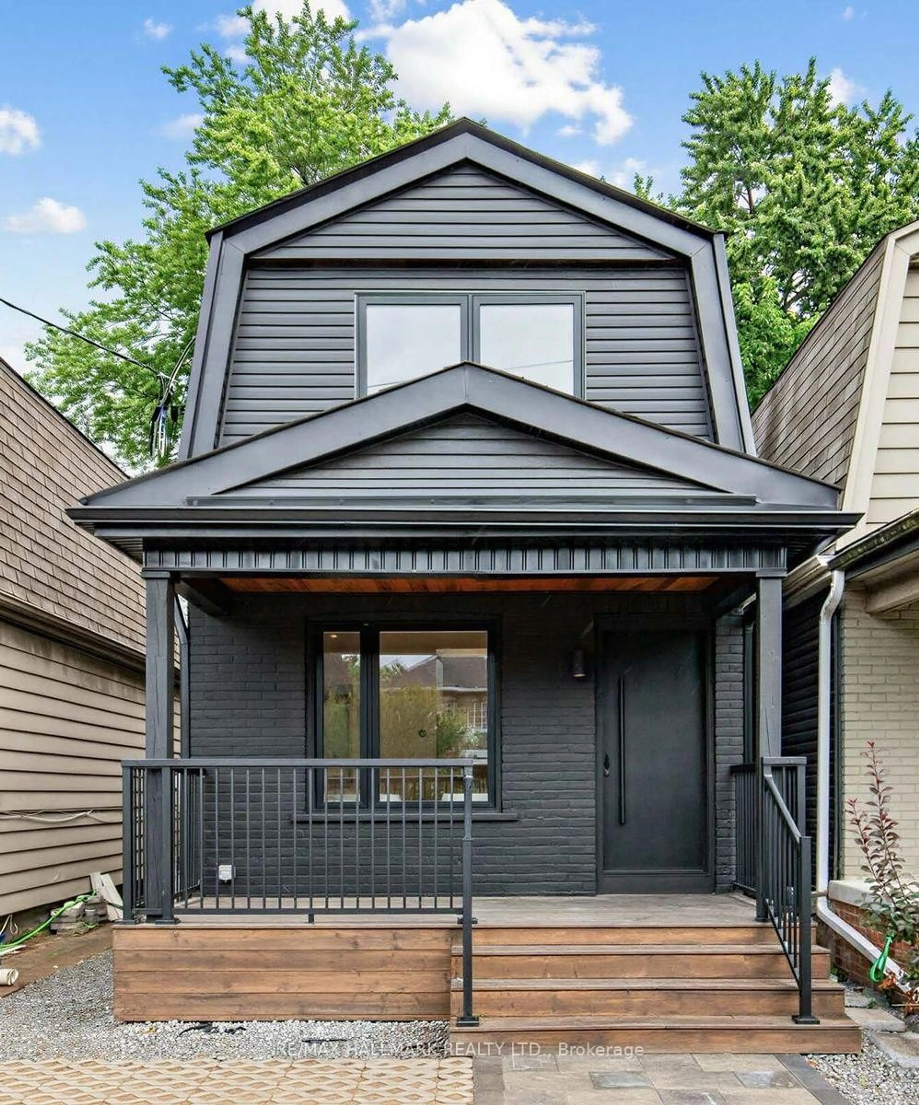 Home with vinyl exterior material, street for 227 Donlands Ave, Toronto Ontario M4J 3P9
