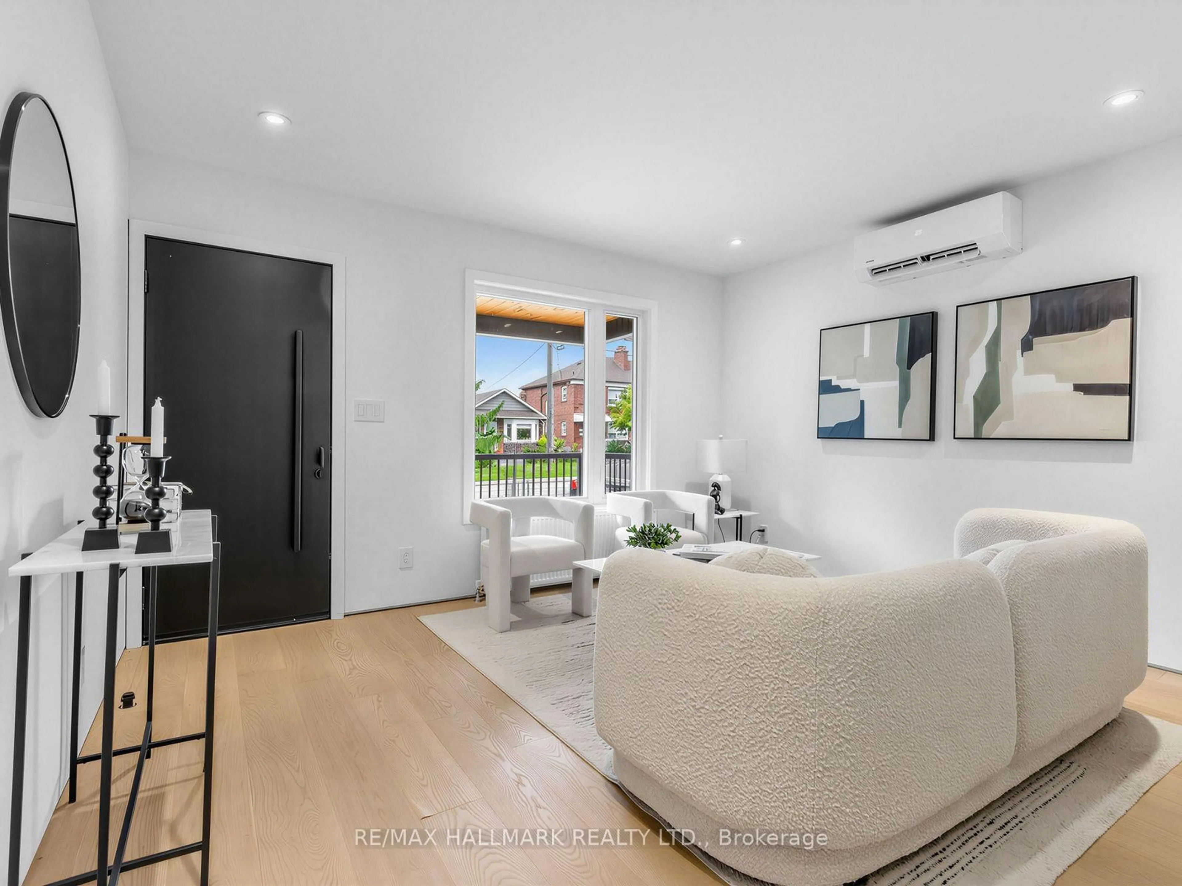 Living room with furniture, unknown for 227 Donlands Ave, Toronto Ontario M4J 3P9