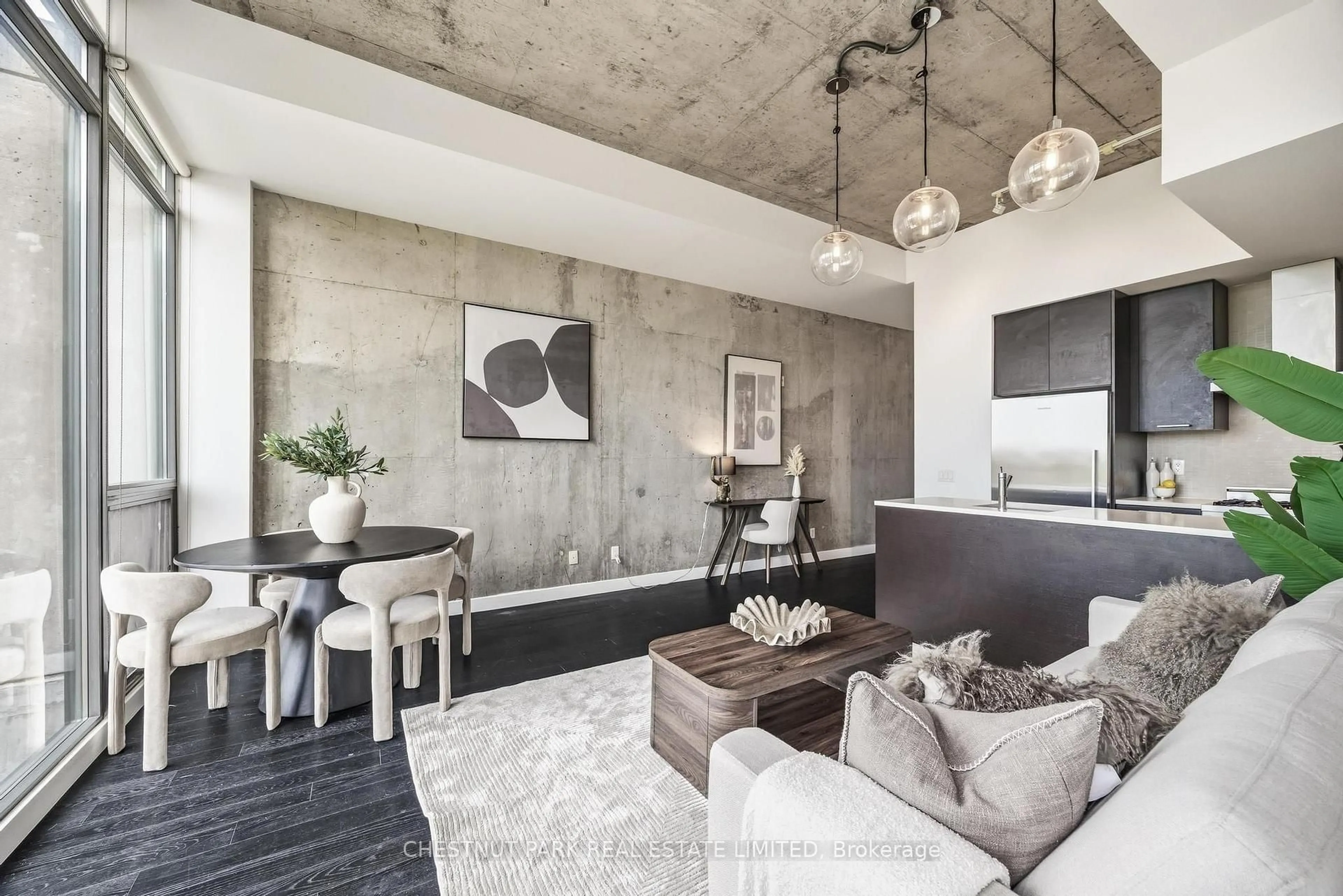 Living room with furniture, cement floor for 90 Broadview Ave #901, Toronto Ontario M4M 0A7