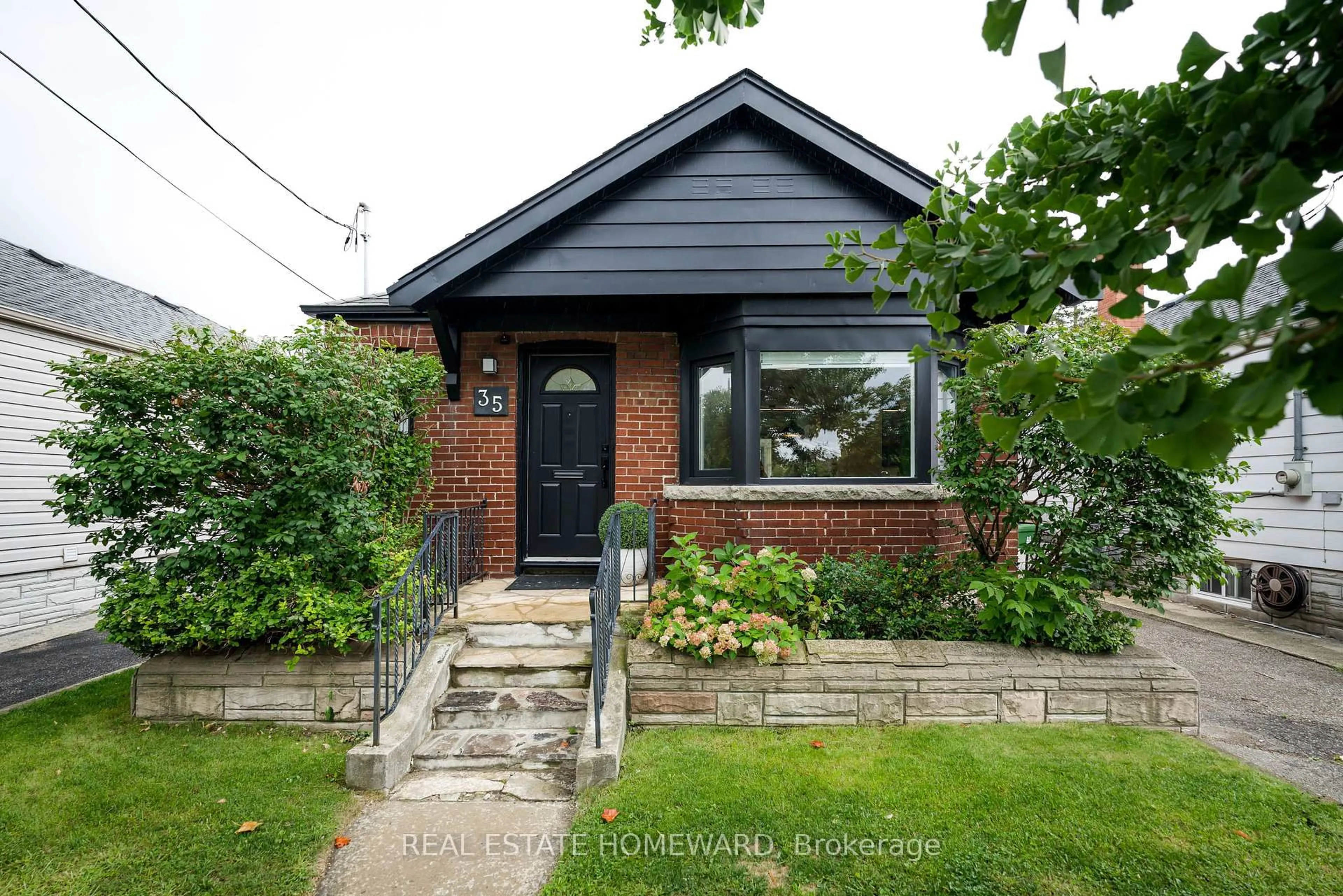 Home with brick exterior material, street for 35 Memorial Park Ave, Toronto Ontario M4J 2J7