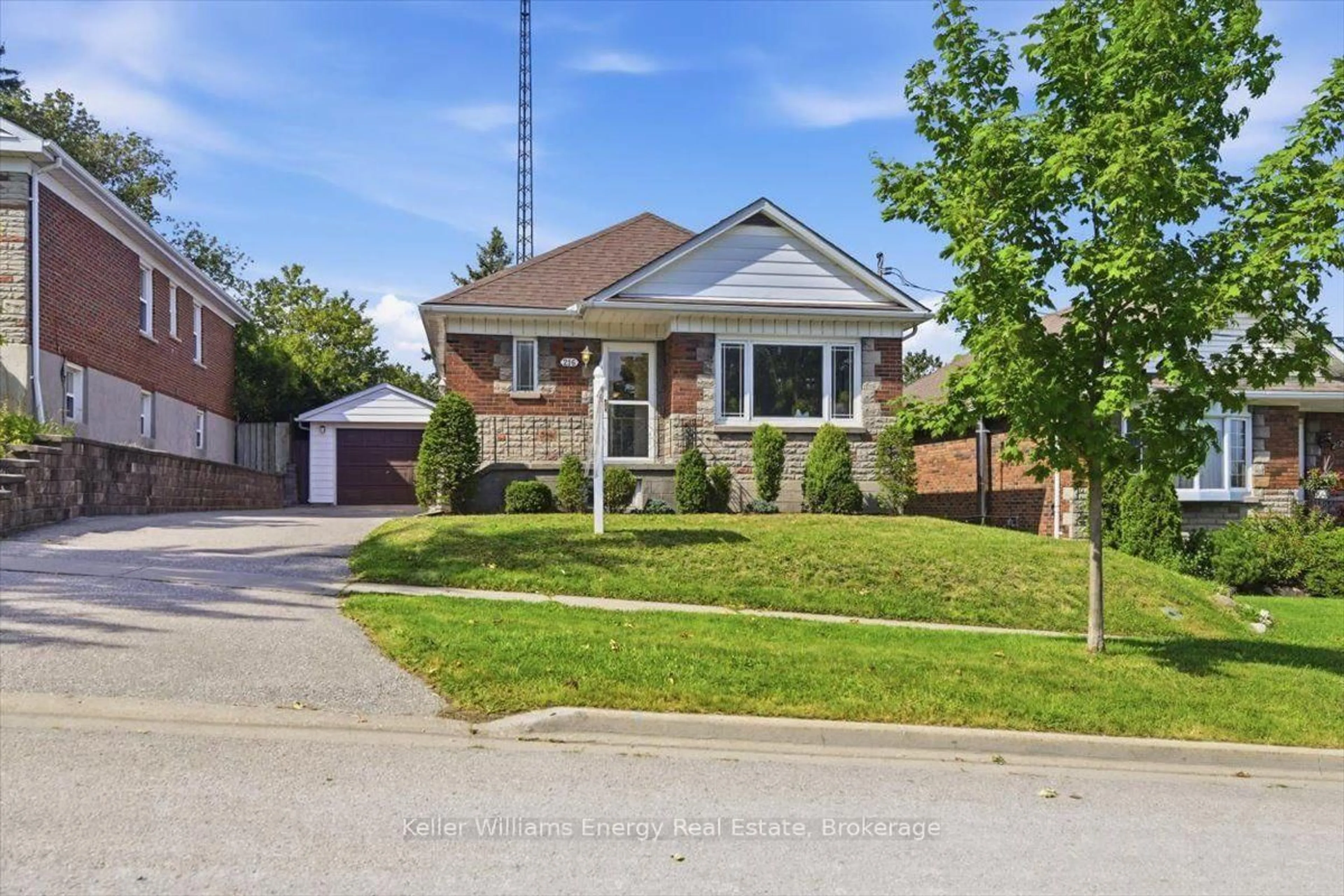 Home with brick exterior material, street for 216 College Ave, Oshawa Ontario L1J 1R7