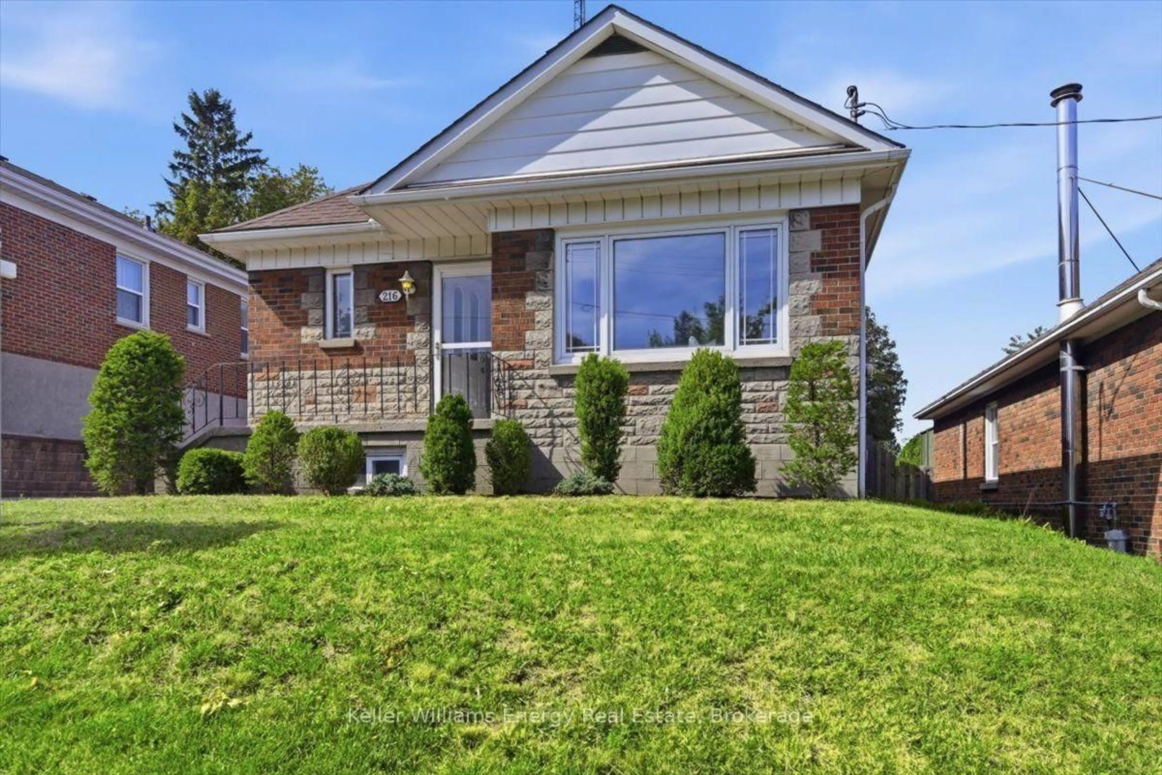 Home with brick exterior material, street for 216 College Ave, Oshawa Ontario L1J 1R7