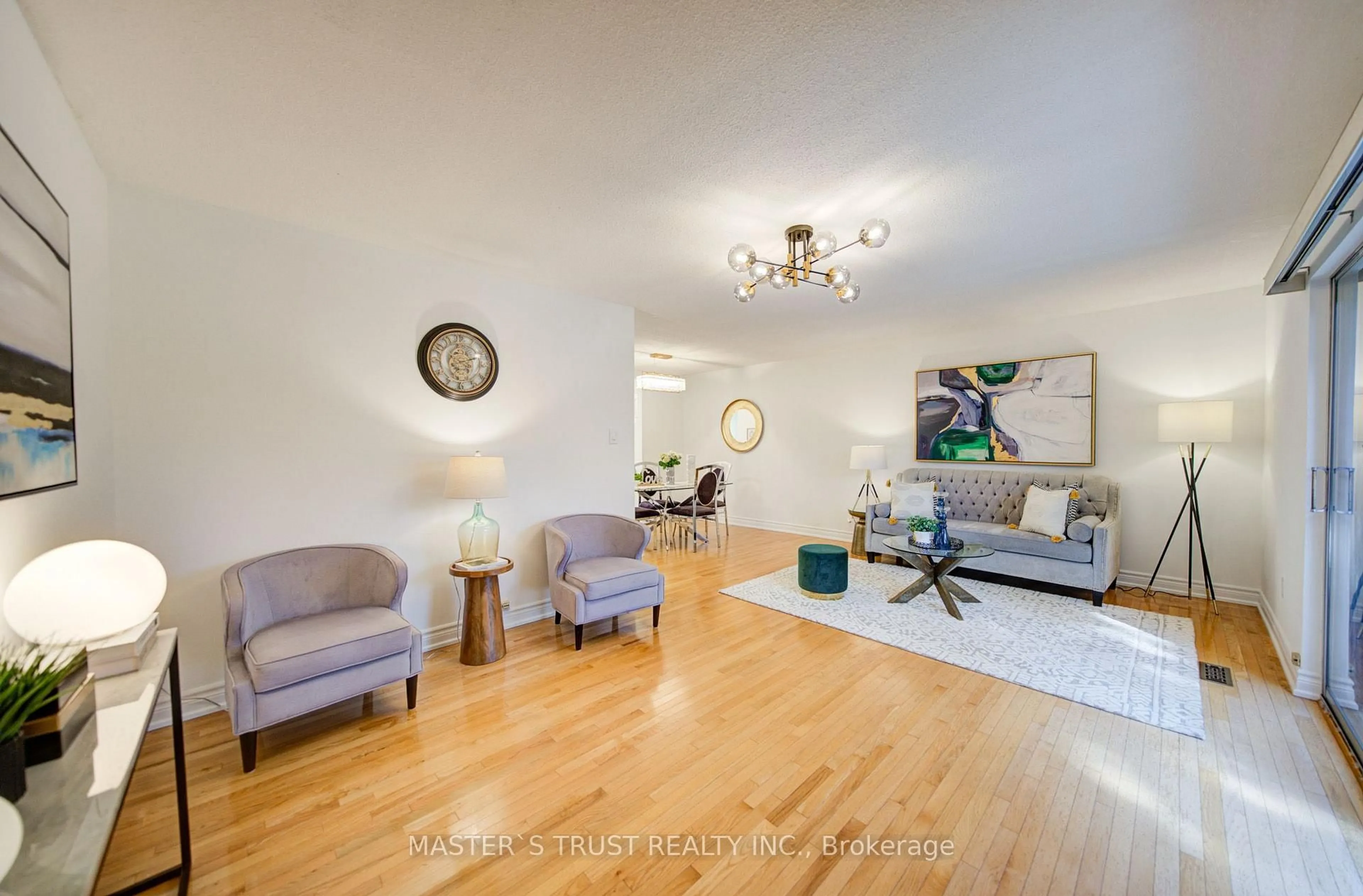 Living room with furniture, wood/laminate floor for 15 Brimwood Blvd #61, Toronto Ontario M1V 1E1