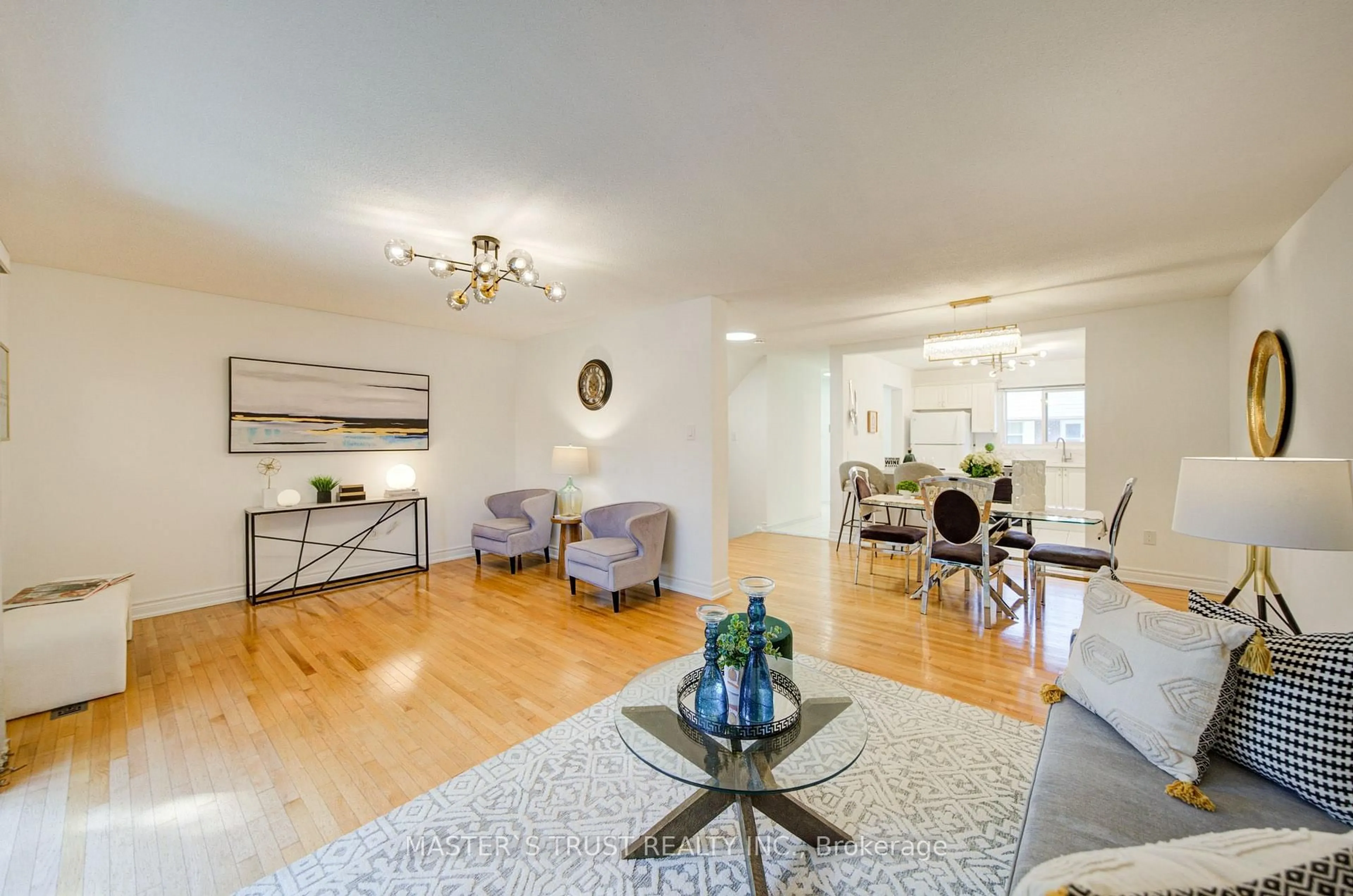 Living room with furniture, wood/laminate floor for 15 Brimwood Blvd #61, Toronto Ontario M1V 1E1