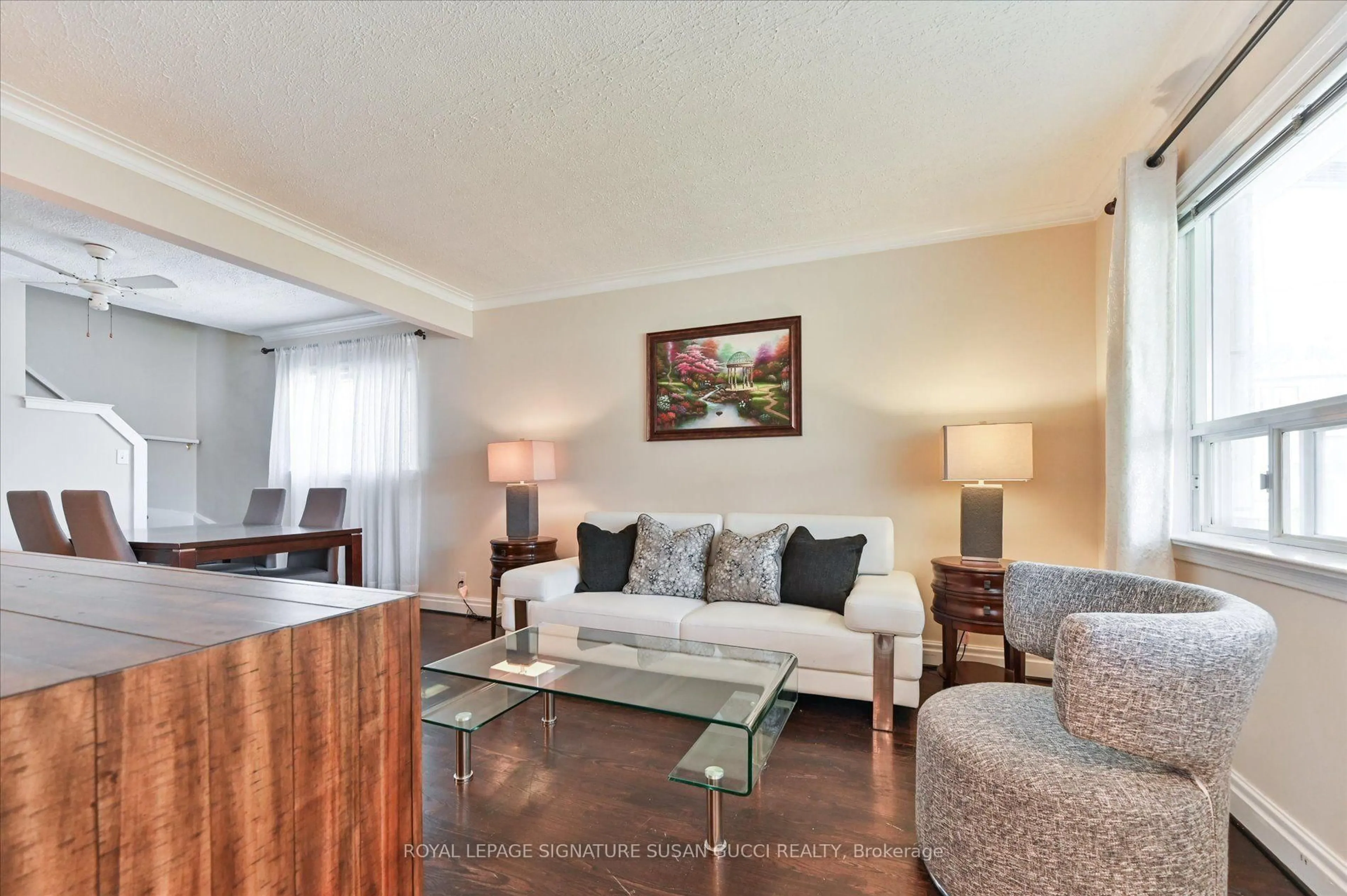 Living room with furniture, wood/laminate floor for 292 Glebemount Ave, Toronto Ontario M4C 3V3