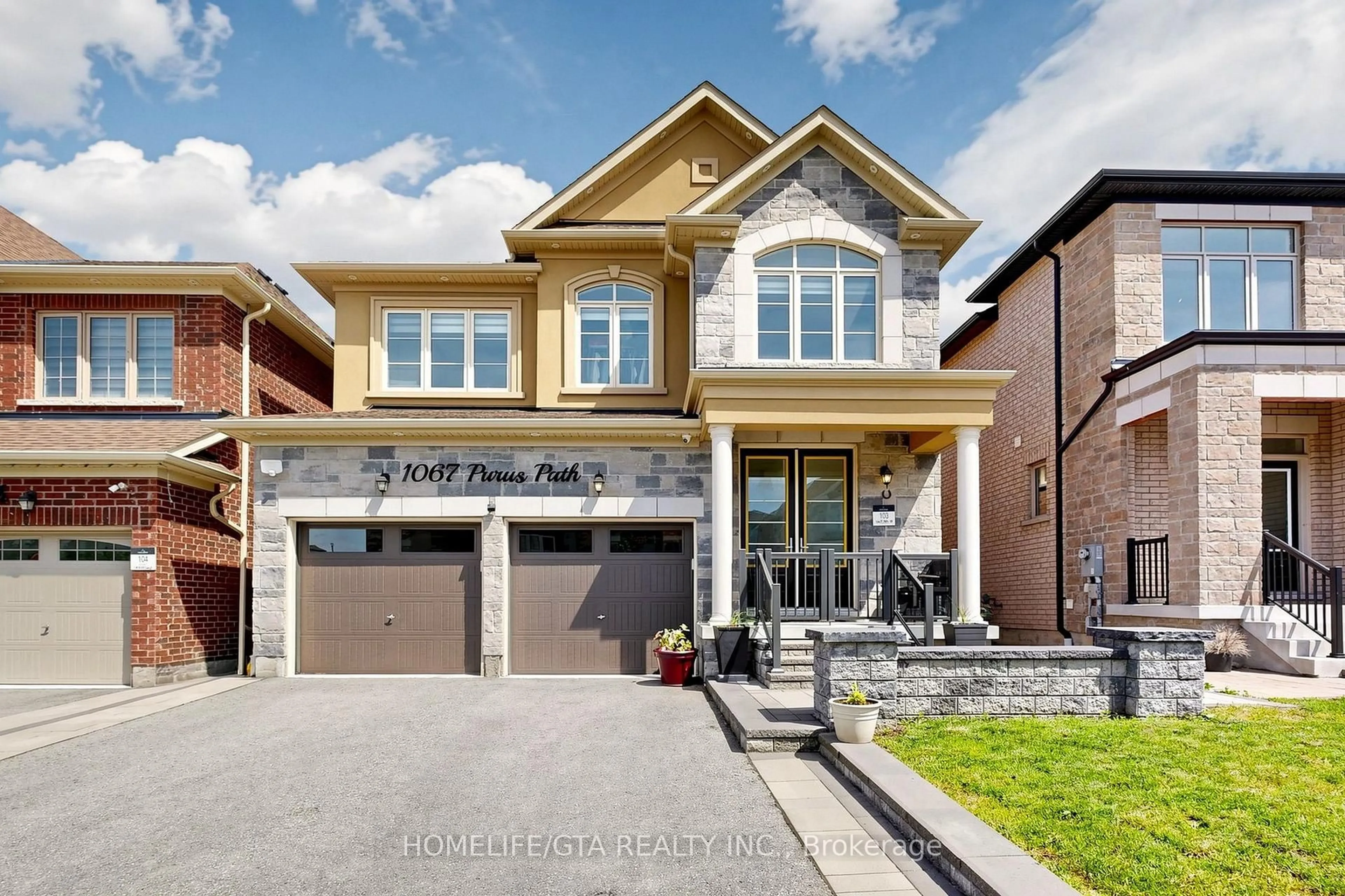 Home with brick exterior material, street for 1067 Purus Path, Pickering Ontario L1X 0H3