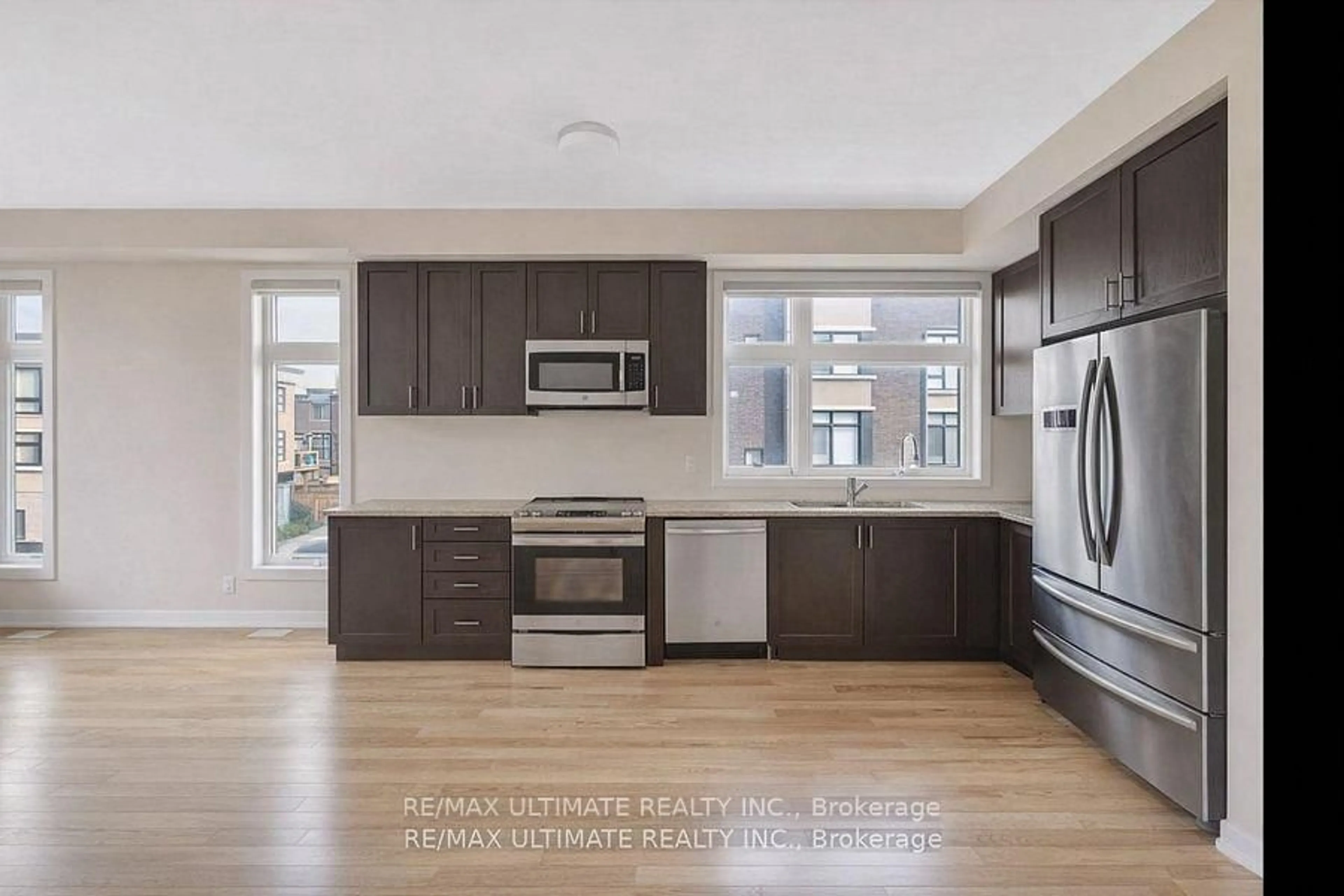 Open concept kitchen, wood/laminate floor for 2632 Castlegate Crossing Dr, Pickering Ontario L1X 0H6