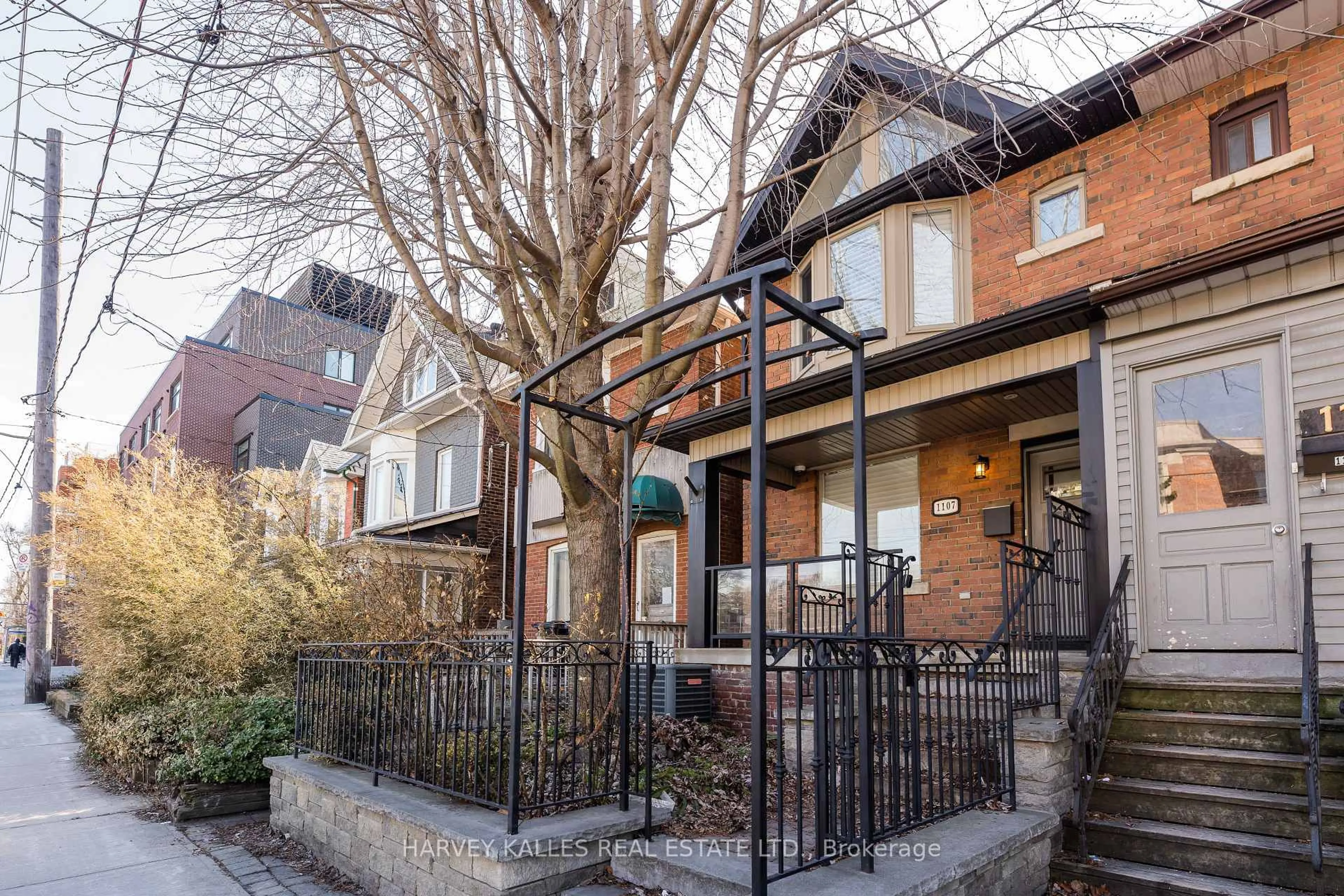 Home with brick exterior material, street for 1107 Gerrard St, Toronto Ontario M4M 1Z9