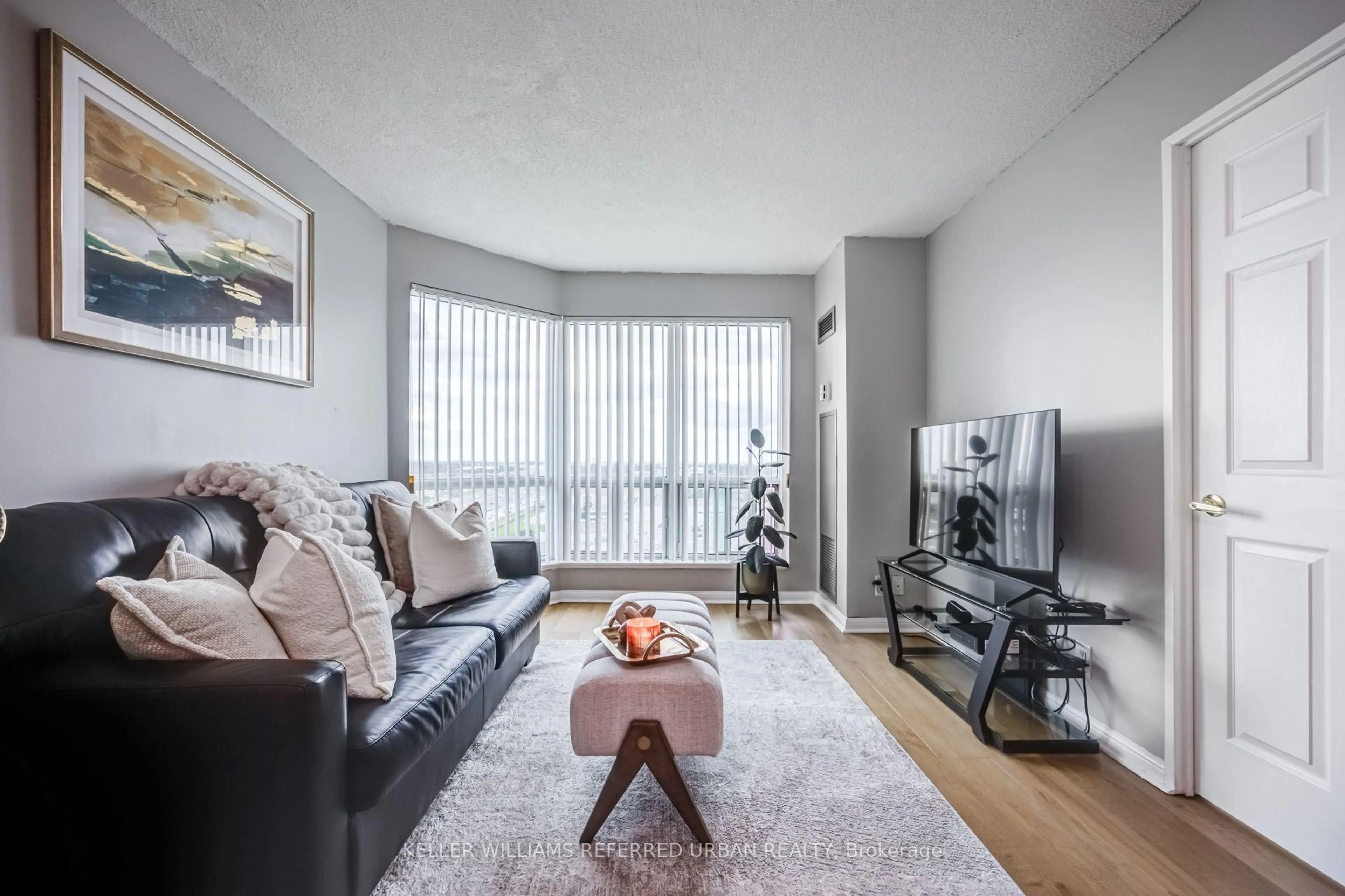 Living room with furniture, wood/laminate floor for 11 Lee Centre Dr #1908, Toronto Ontario M1H 3J5