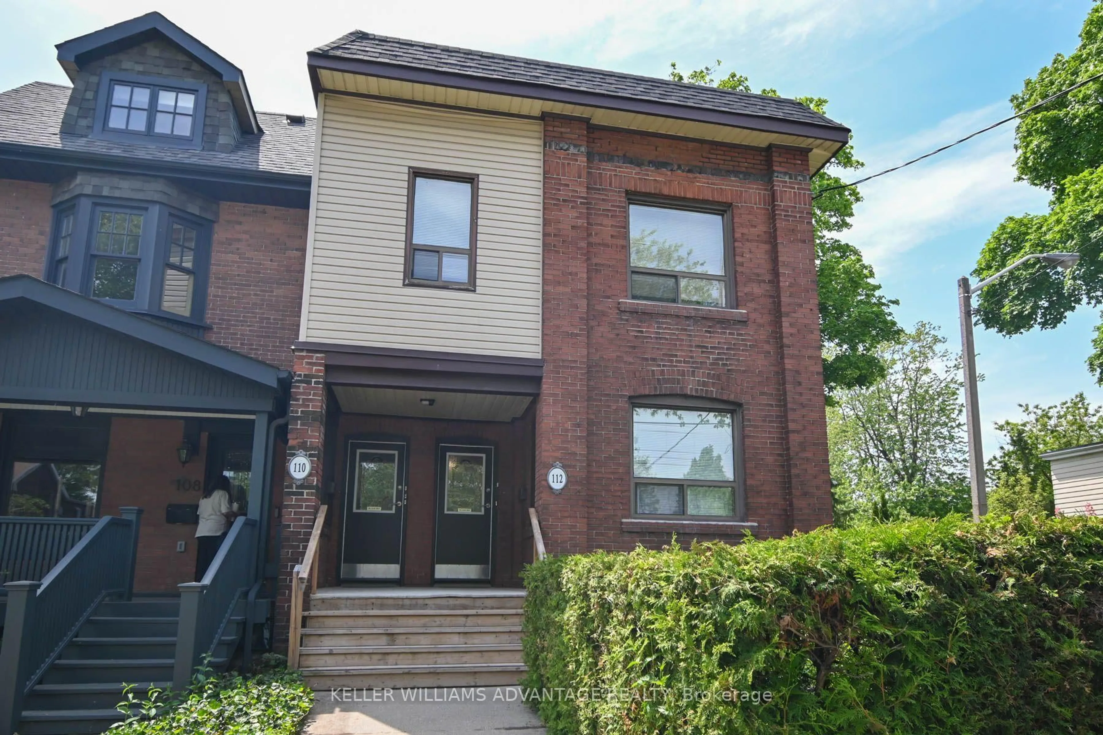 Home with brick exterior material, street for 110-112 Dewhurst Blvd, Toronto Ontario M4J 3J3