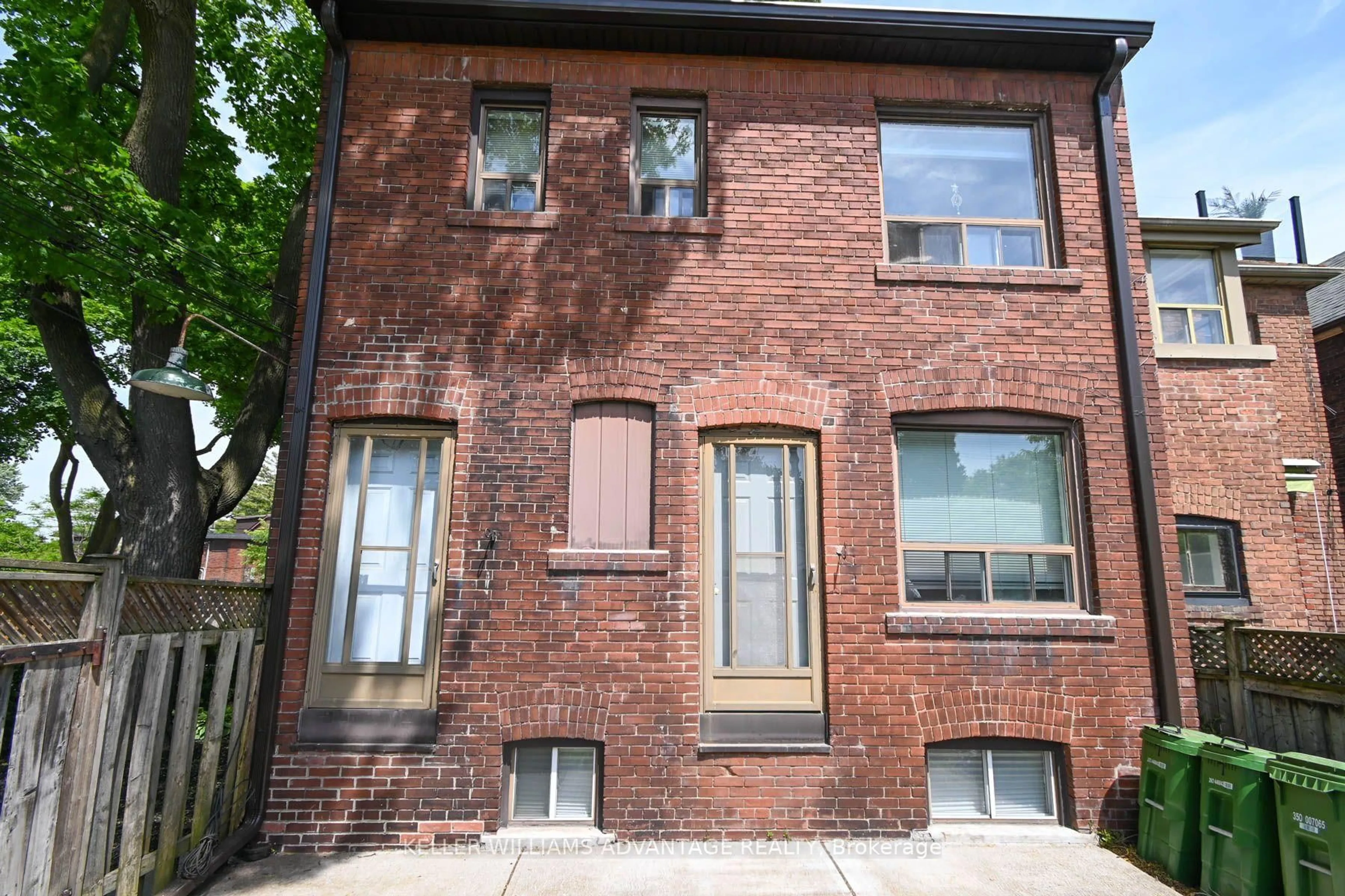 Home with brick exterior material, street for 110-112 Dewhurst Blvd, Toronto Ontario M4J 3J3