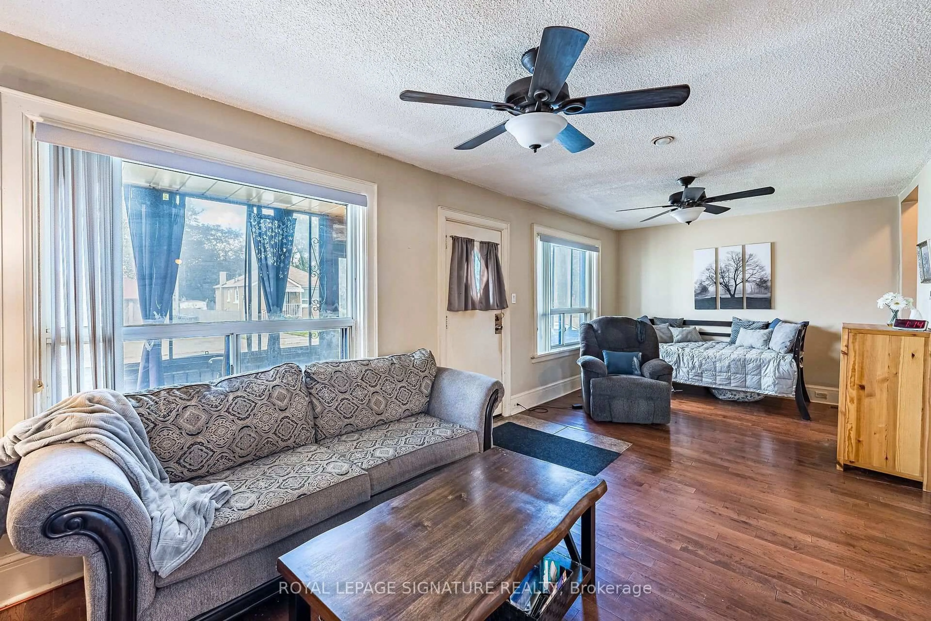 Living room with furniture, wood/laminate floor for 1 Davidson Ave, Toronto Ontario M1K 1C2