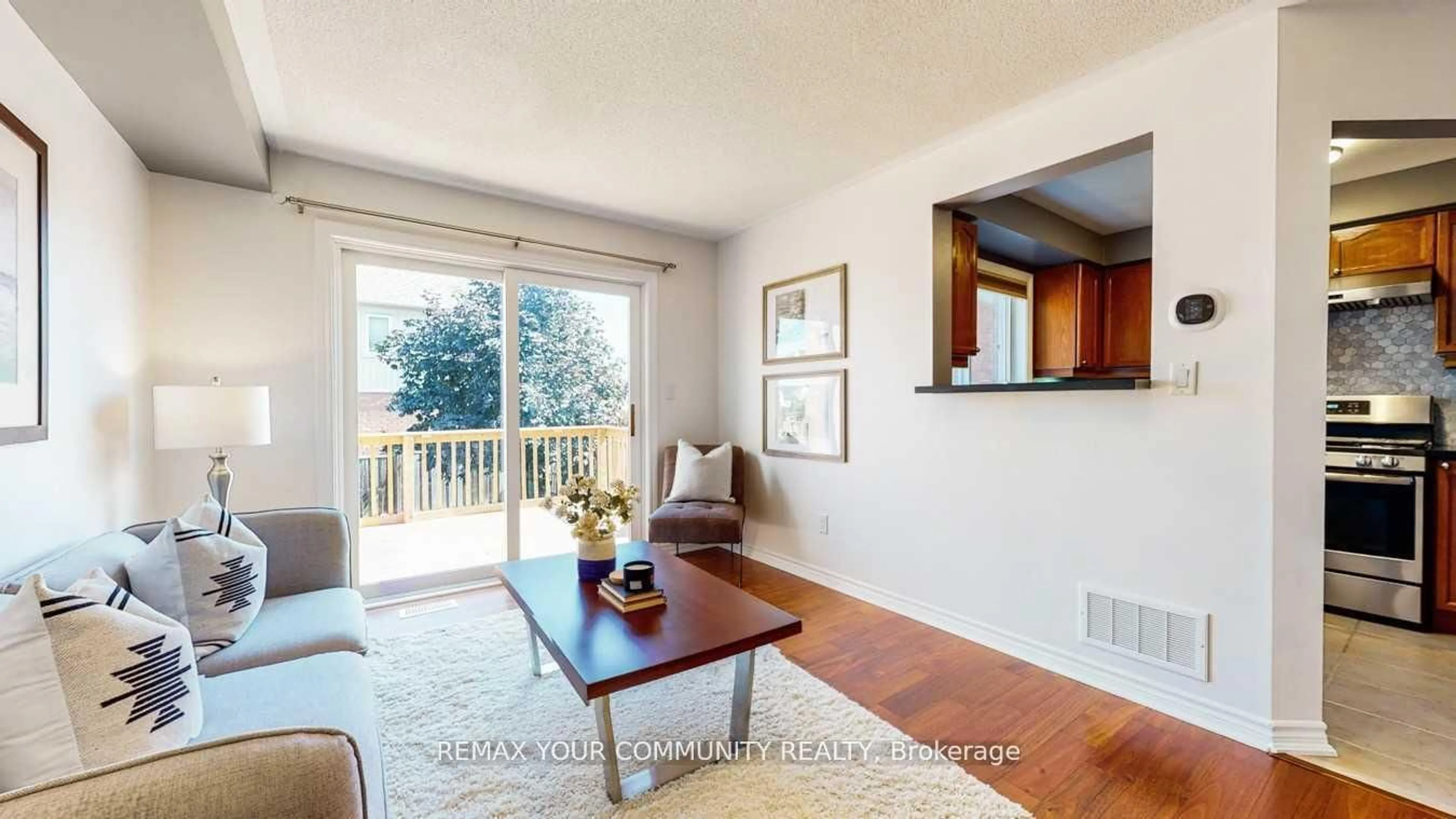 Living room with furniture, wood/laminate floor for 143 Cornish Dr, Clarington Ontario L1E 3G9