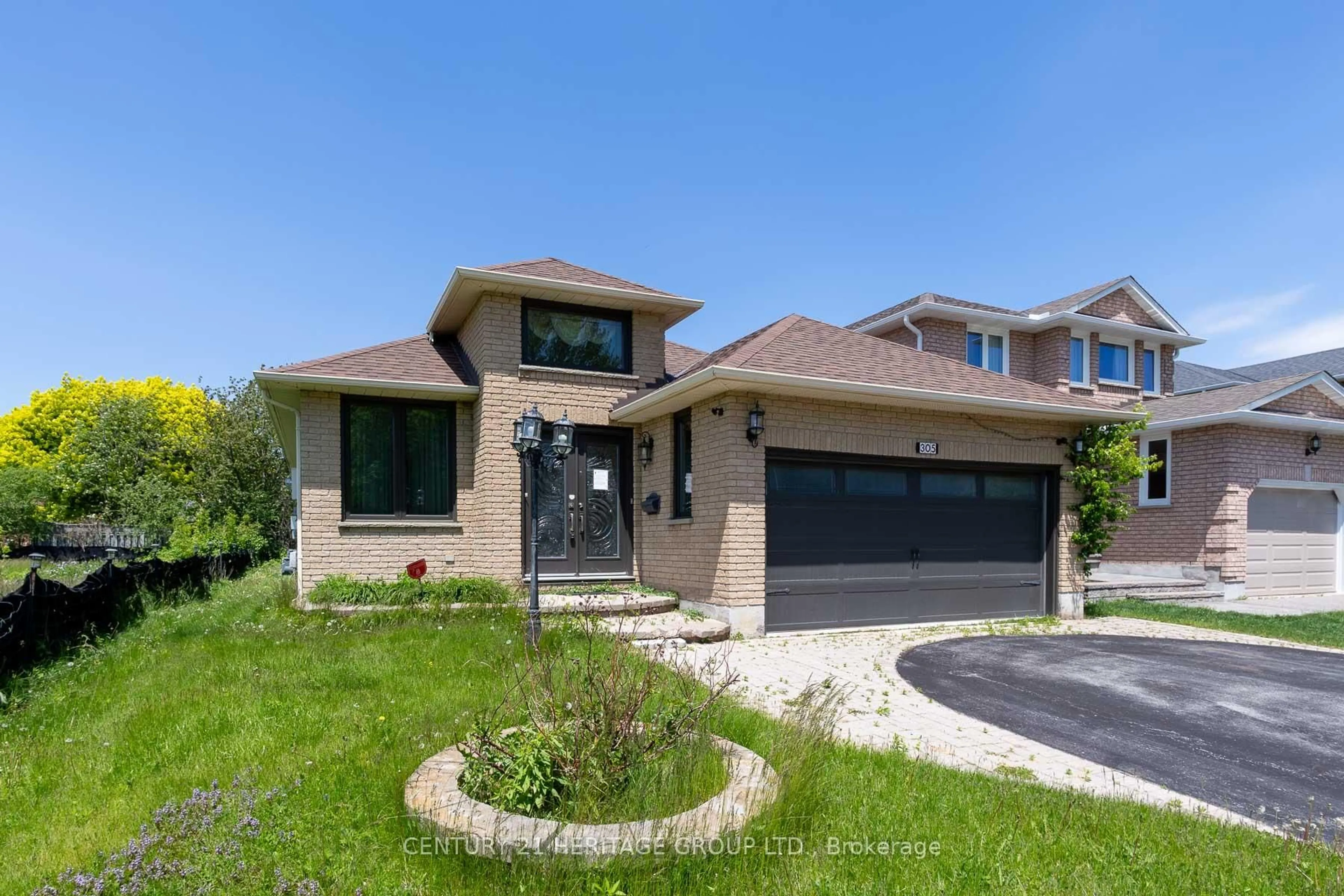 Home with brick exterior material, street for 305 Sandringham Dr, Clarington Ontario L1E 3A7
