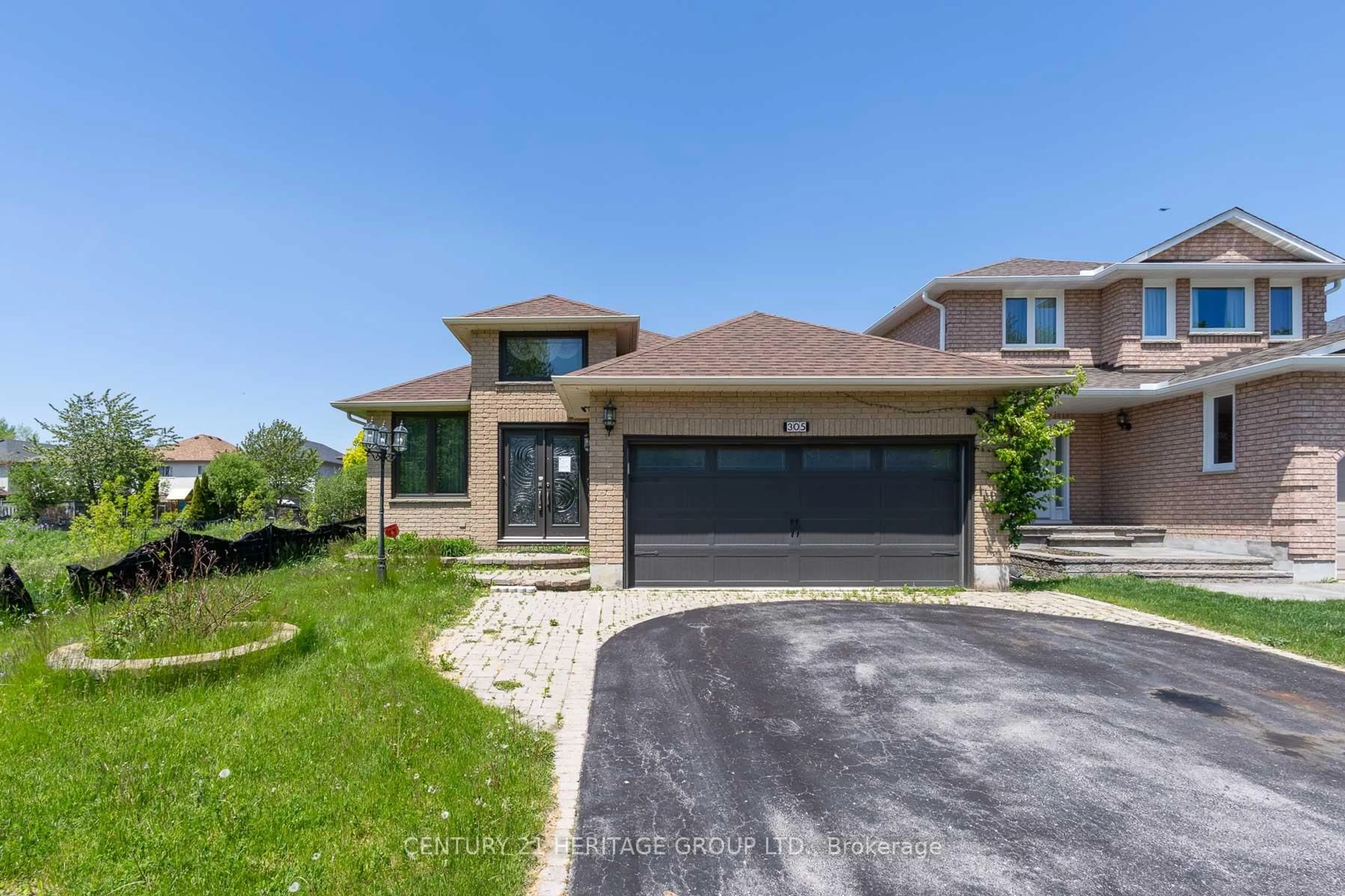 Home with brick exterior material, street for 305 Sandringham Dr, Clarington Ontario L1E 3A7