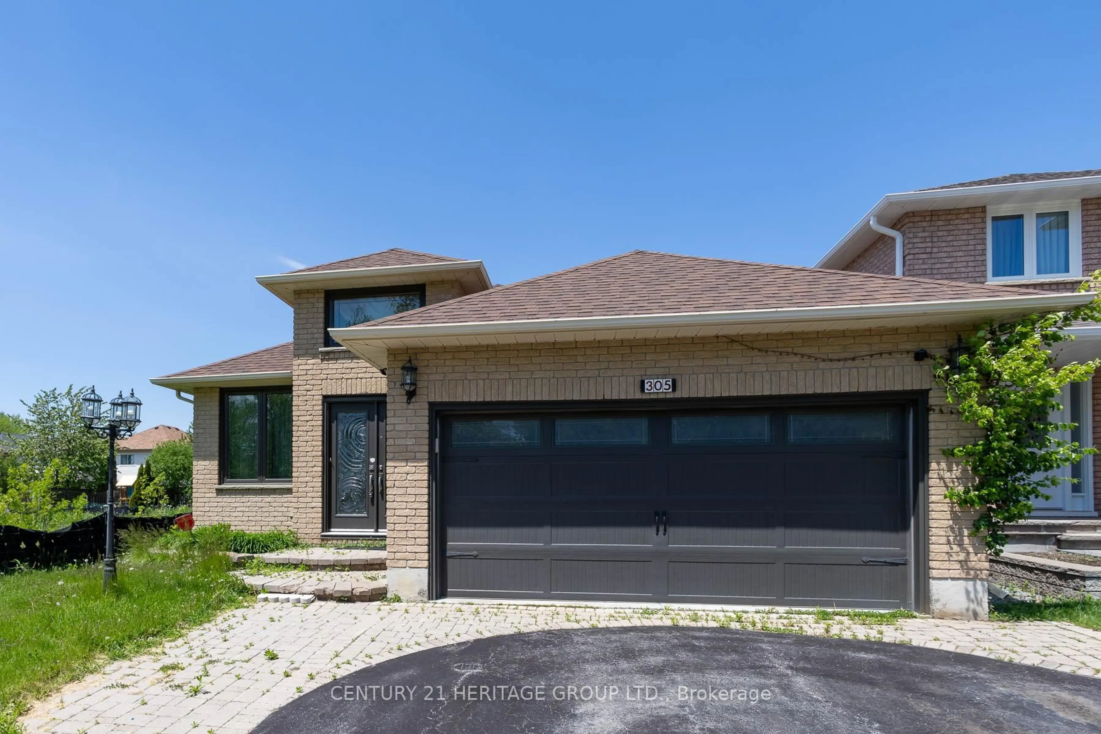 Home with brick exterior material, street for 305 Sandringham Dr, Clarington Ontario L1E 3A7