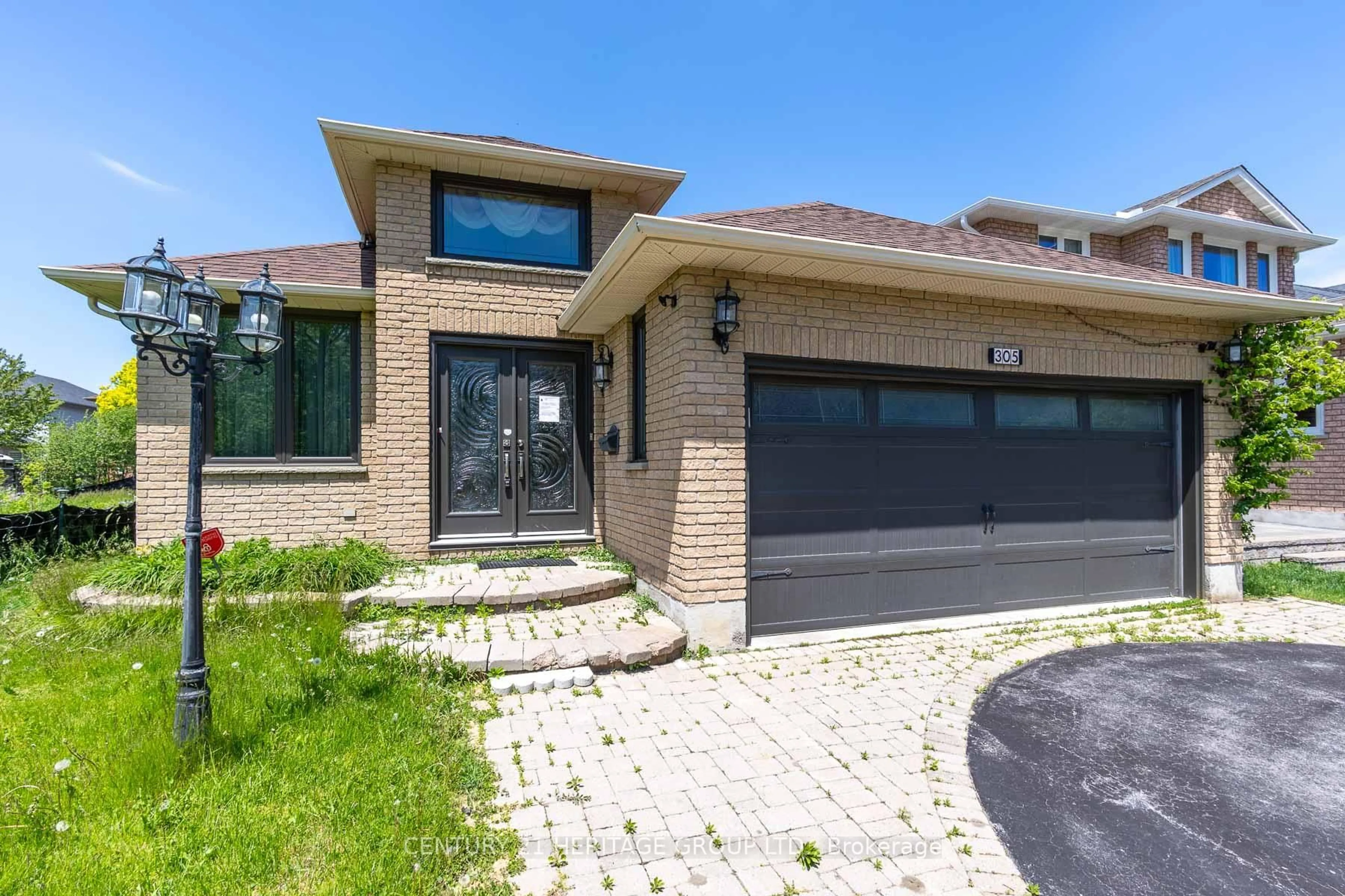 Home with brick exterior material, street for 305 Sandringham Dr, Clarington Ontario L1E 3A7