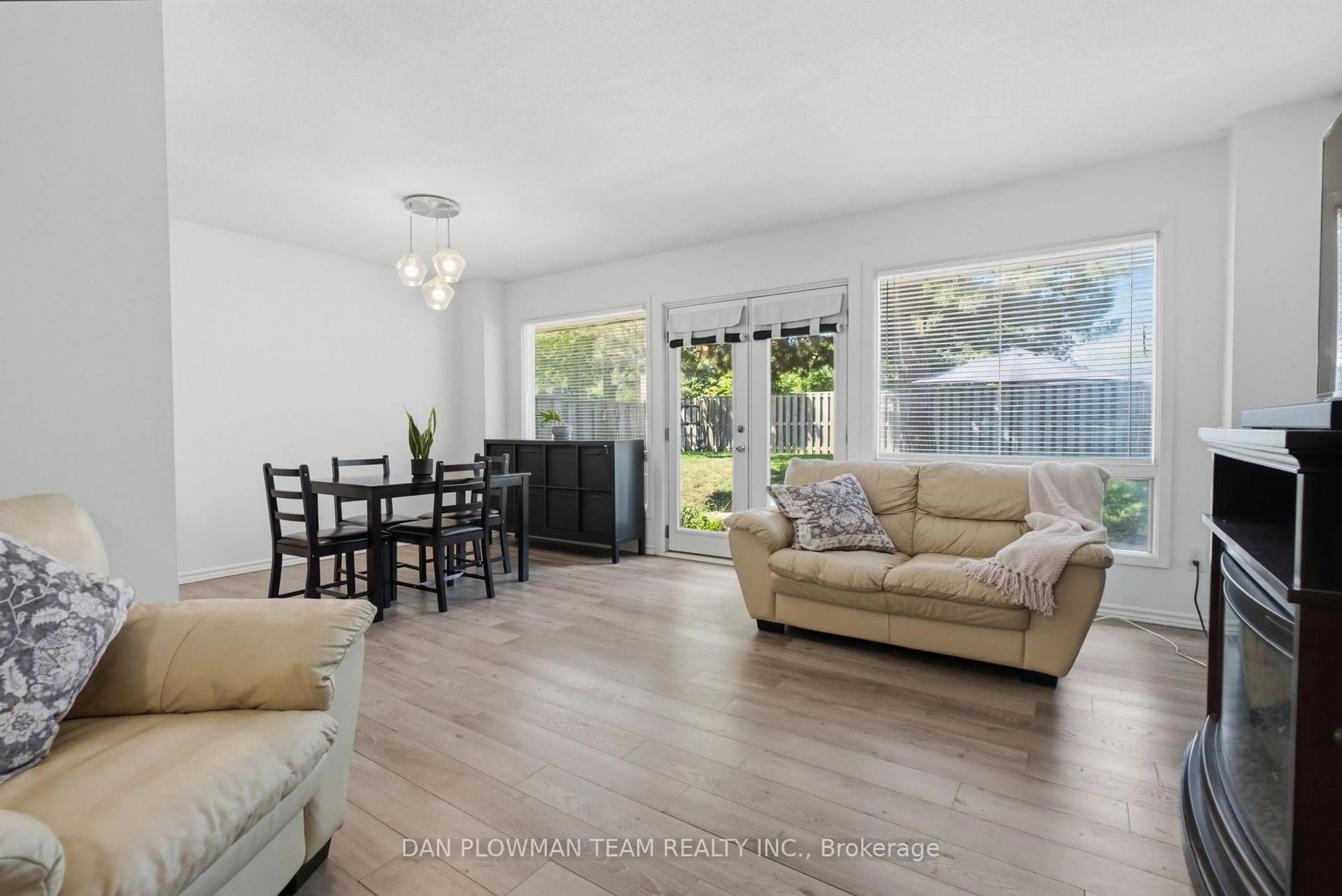 Living room with furniture, wood/laminate floor for 11 Livonia Pl #32, Toronto Ontario M1E 4W5
