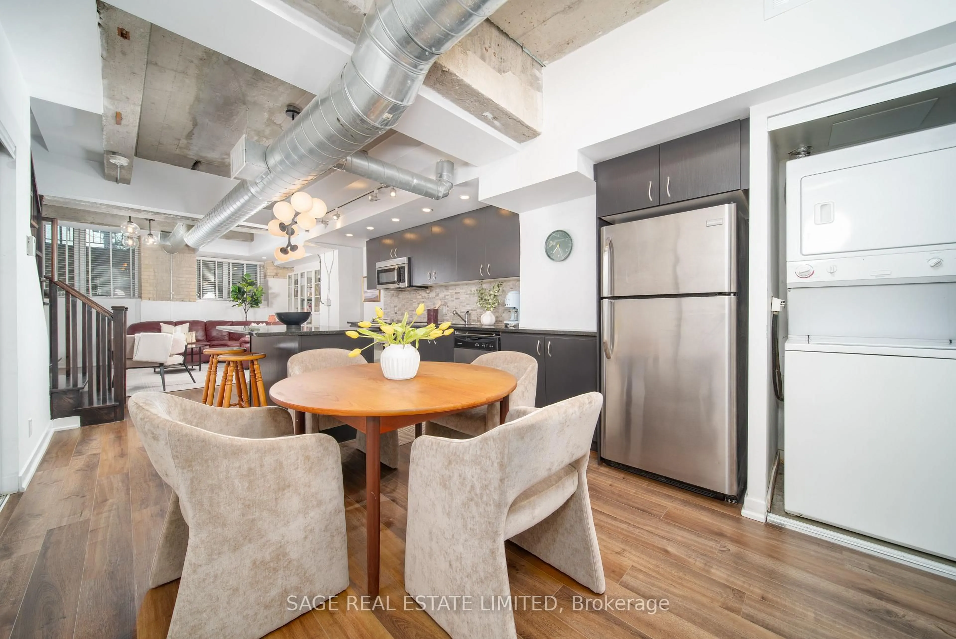Open concept kitchen, cement floor for 201 Carlaw Ave #128, Toronto Ontario M4M 2S3