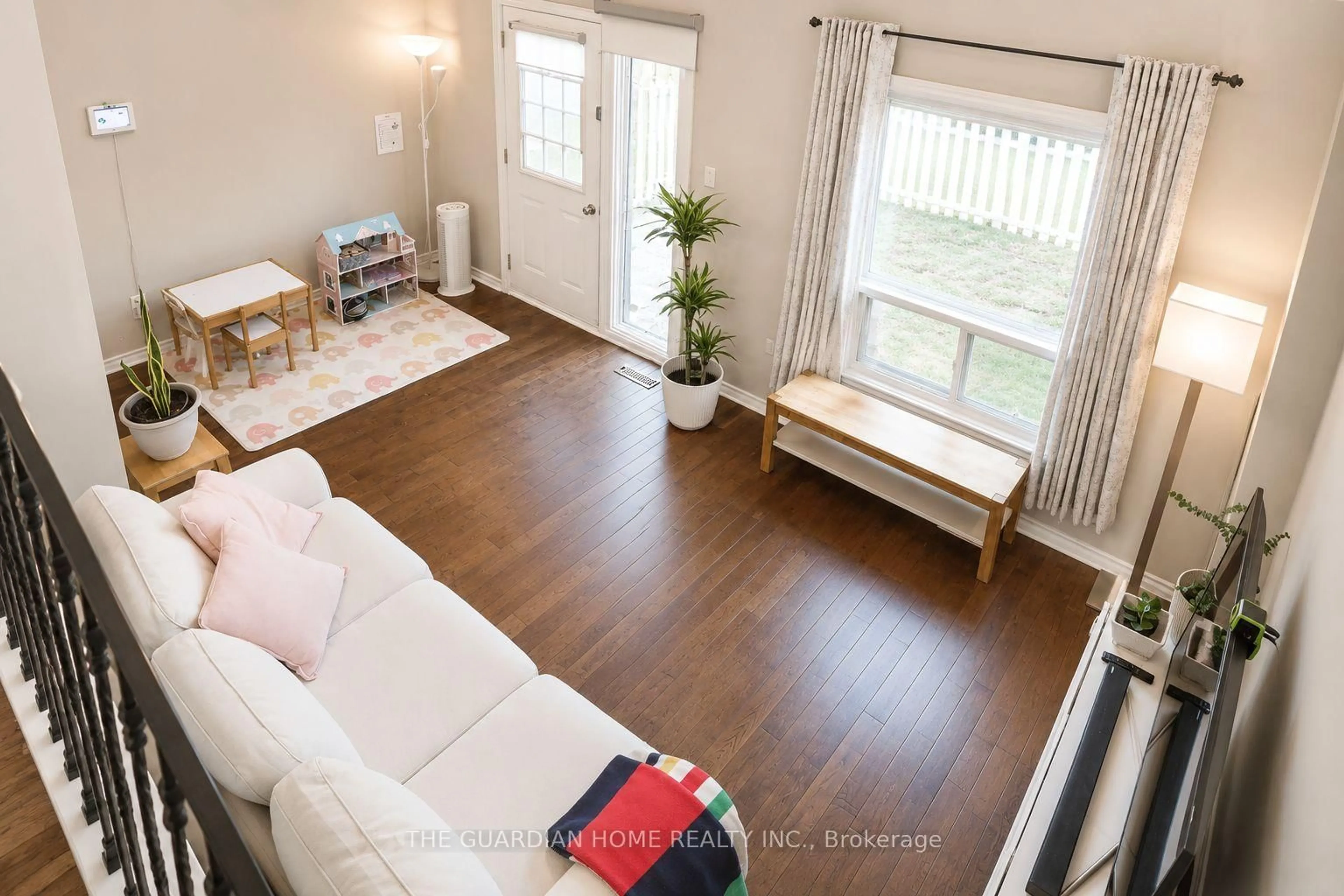 Living room with furniture, wood/laminate floor for 1975 Memory Lane #28, Pickering Ontario L1V 3M3