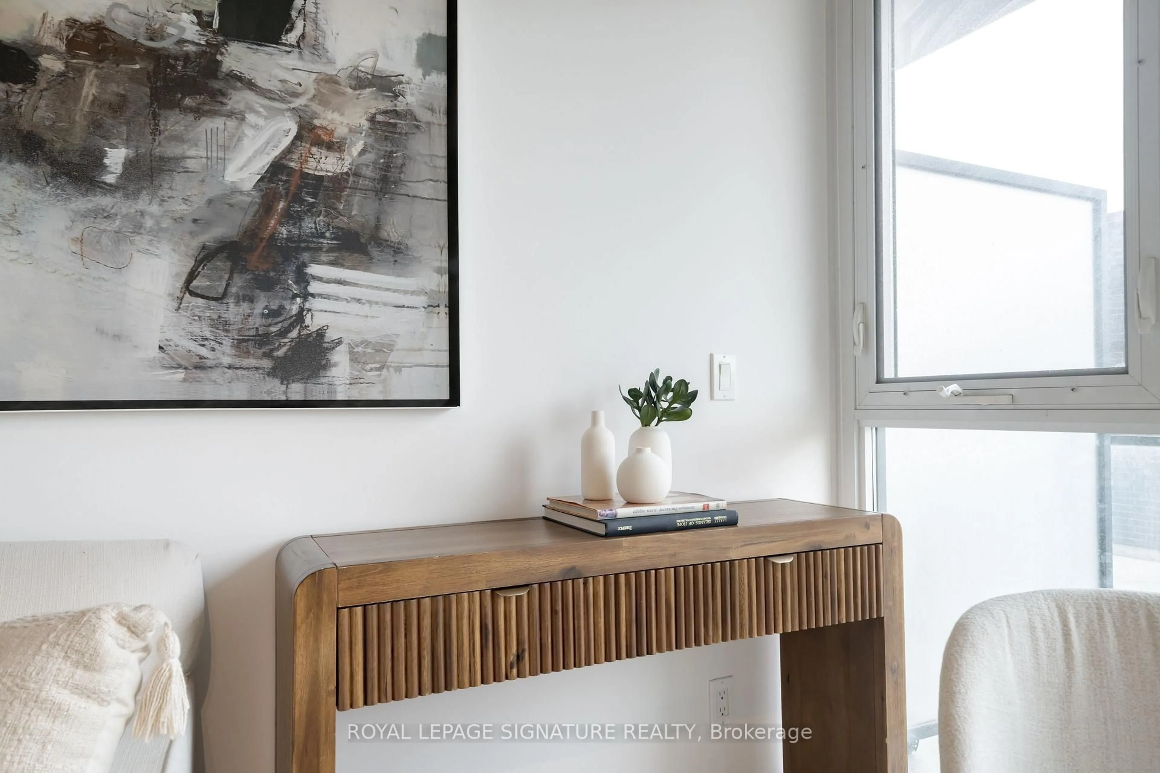 Living room with furniture, wood/laminate floor for 1190 Dundas St #406, Toronto Ontario M4M 0C5