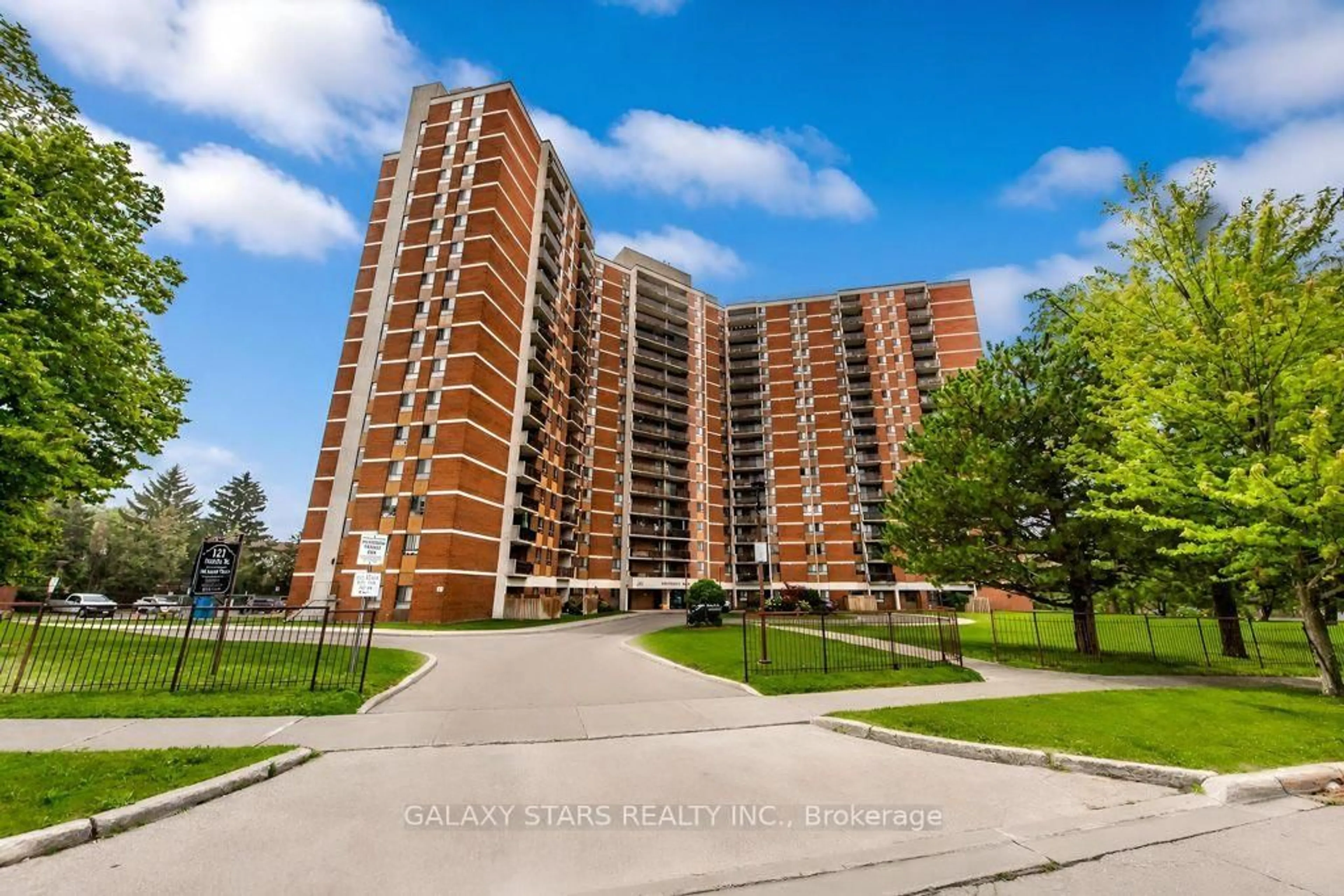 A pic from outside/outdoor area/front of a property/back of a property/a pic from drone, building for 121 Trudelle St #305, Toronto Ontario M1J 3K4
