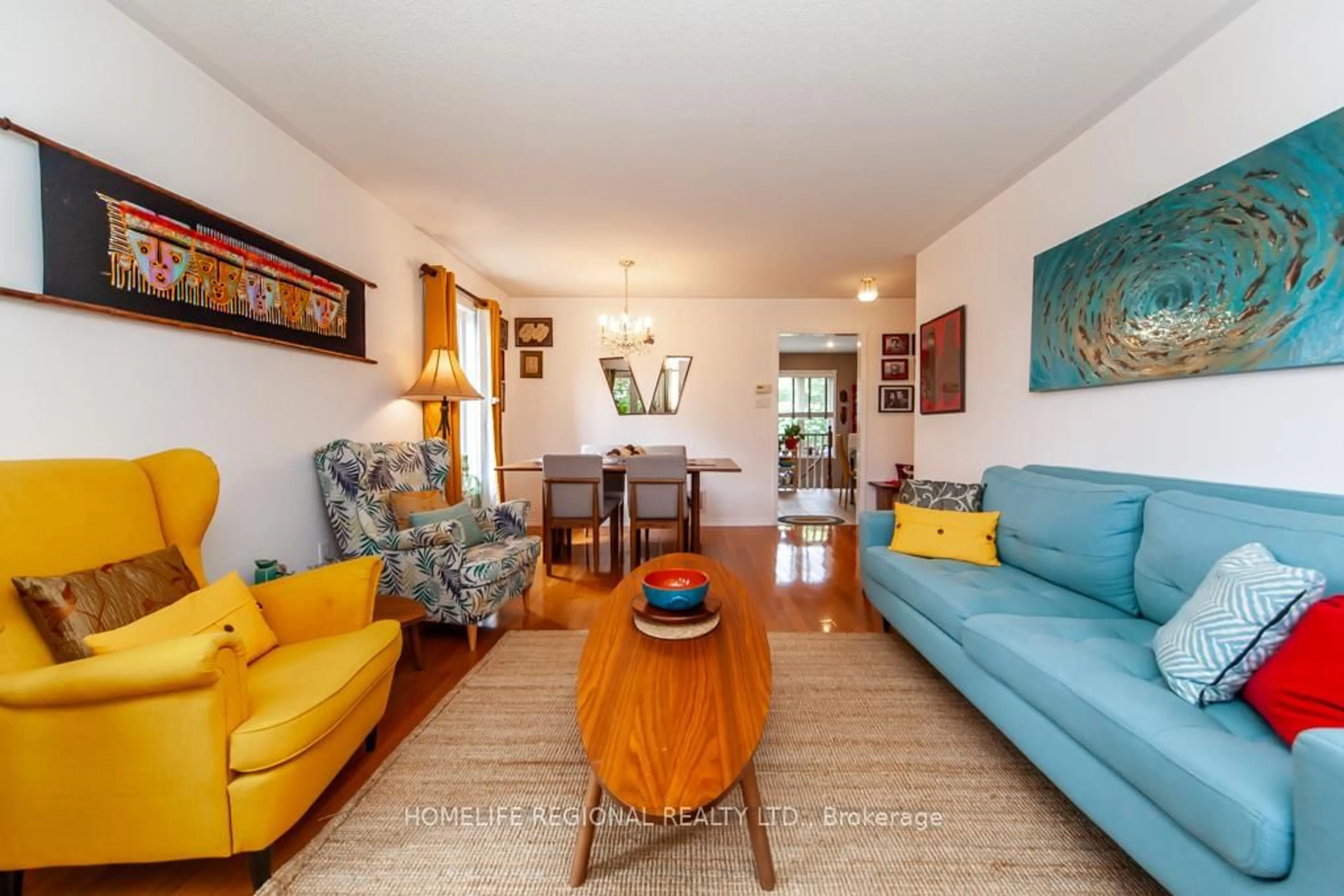 Living room with furniture, wood/laminate floor for 20 Rosemarie Cres, Whitby Ontario L1M 1G6