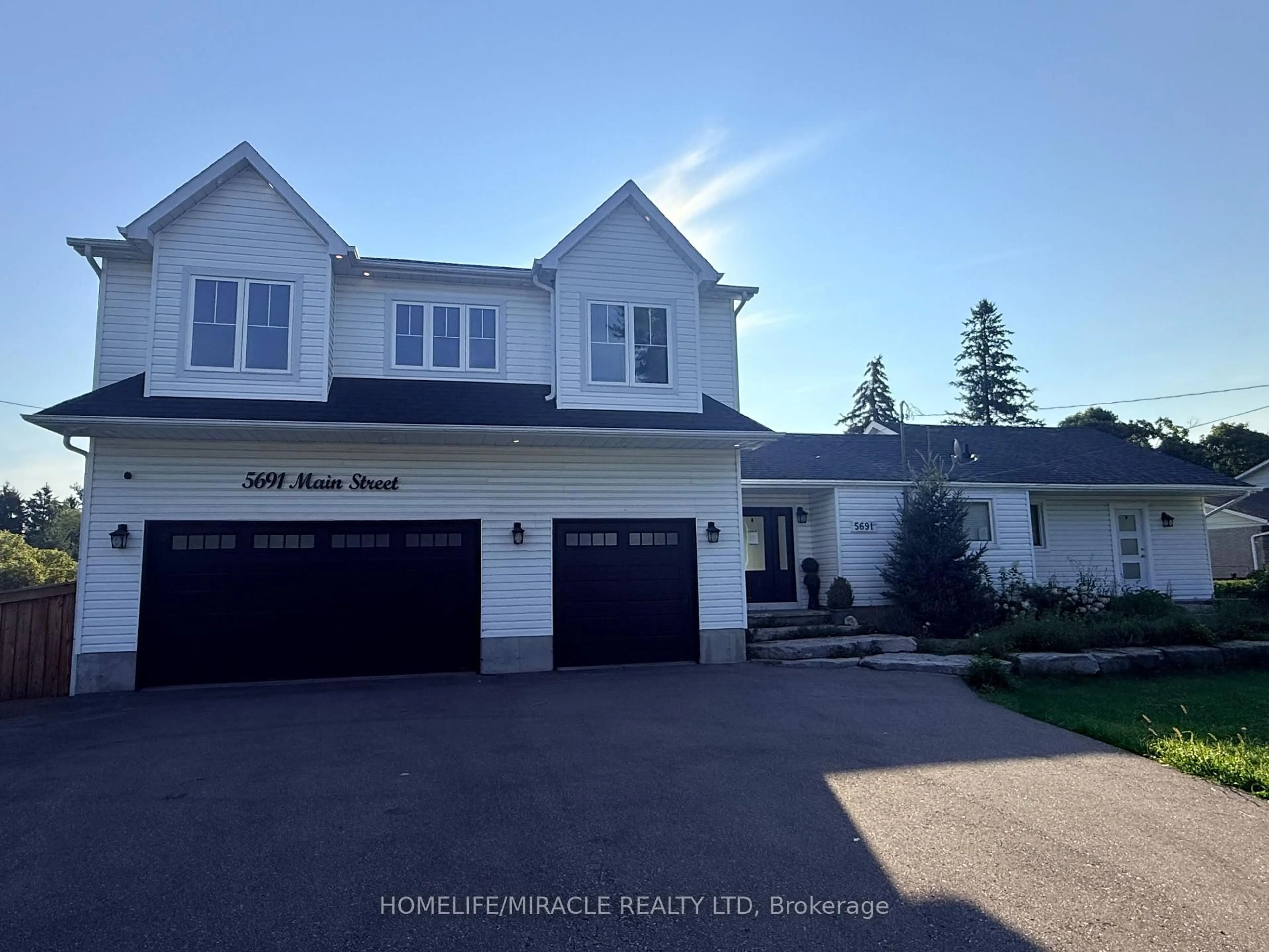 Home with vinyl exterior material, street for 5691 Main St, Clarington Ontario L0B 1M0