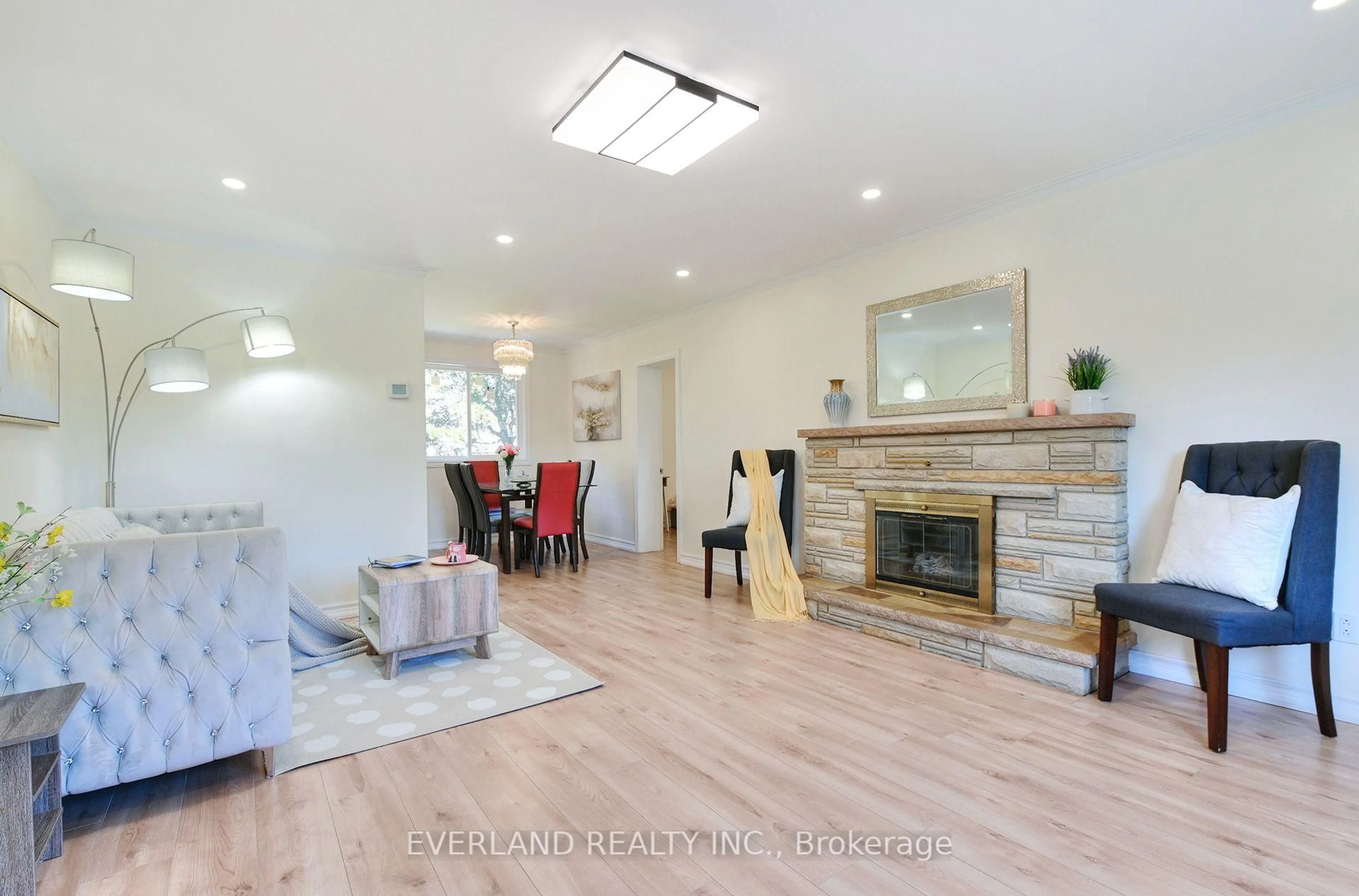 Living room with furniture, wood/laminate floor for 52 Fairglen Ave, Toronto Ontario M1T 1G7