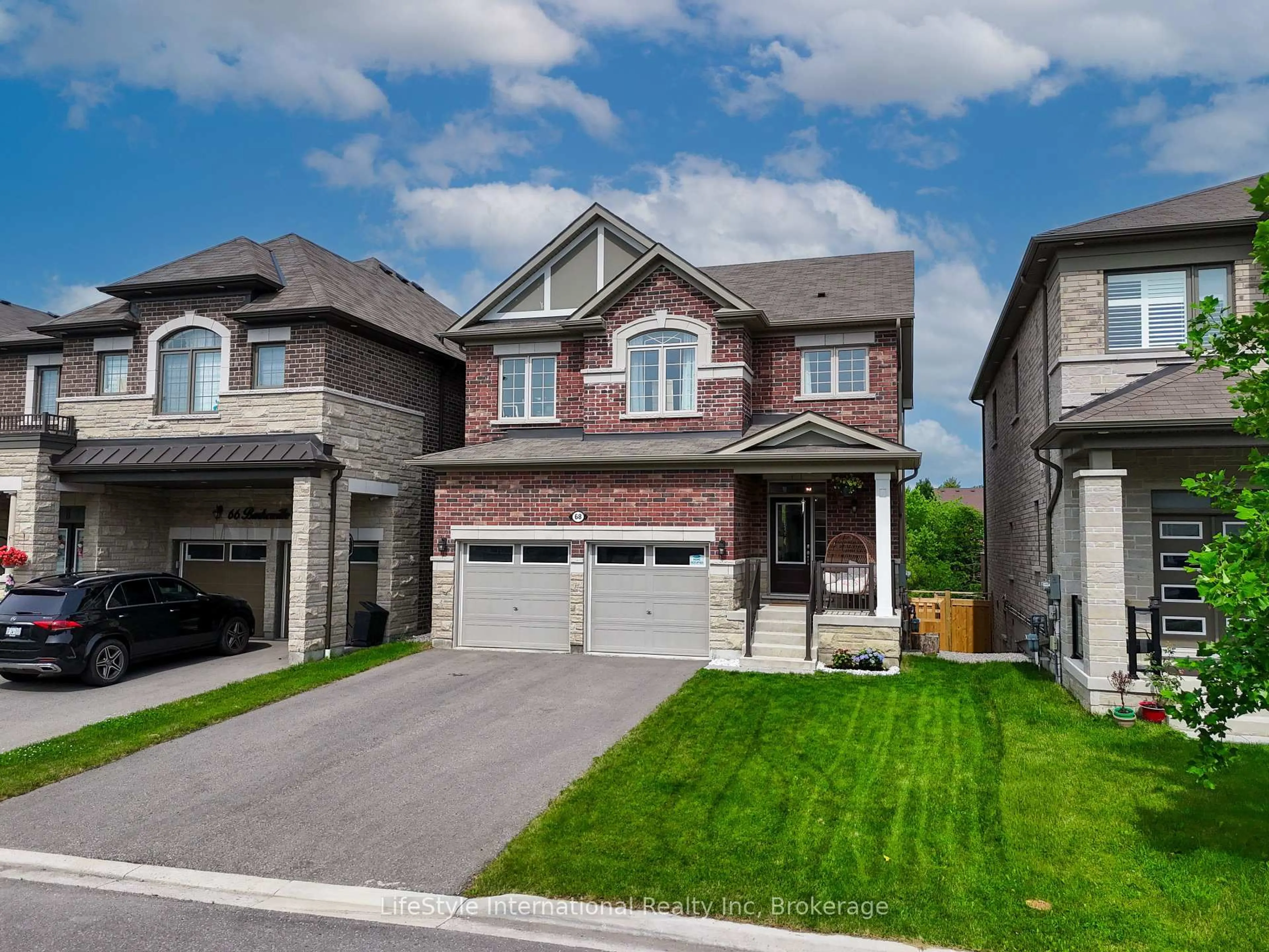 Home with brick exterior material, street for 68 Barkerville Dr, Whitby Ontario L1P 0L8