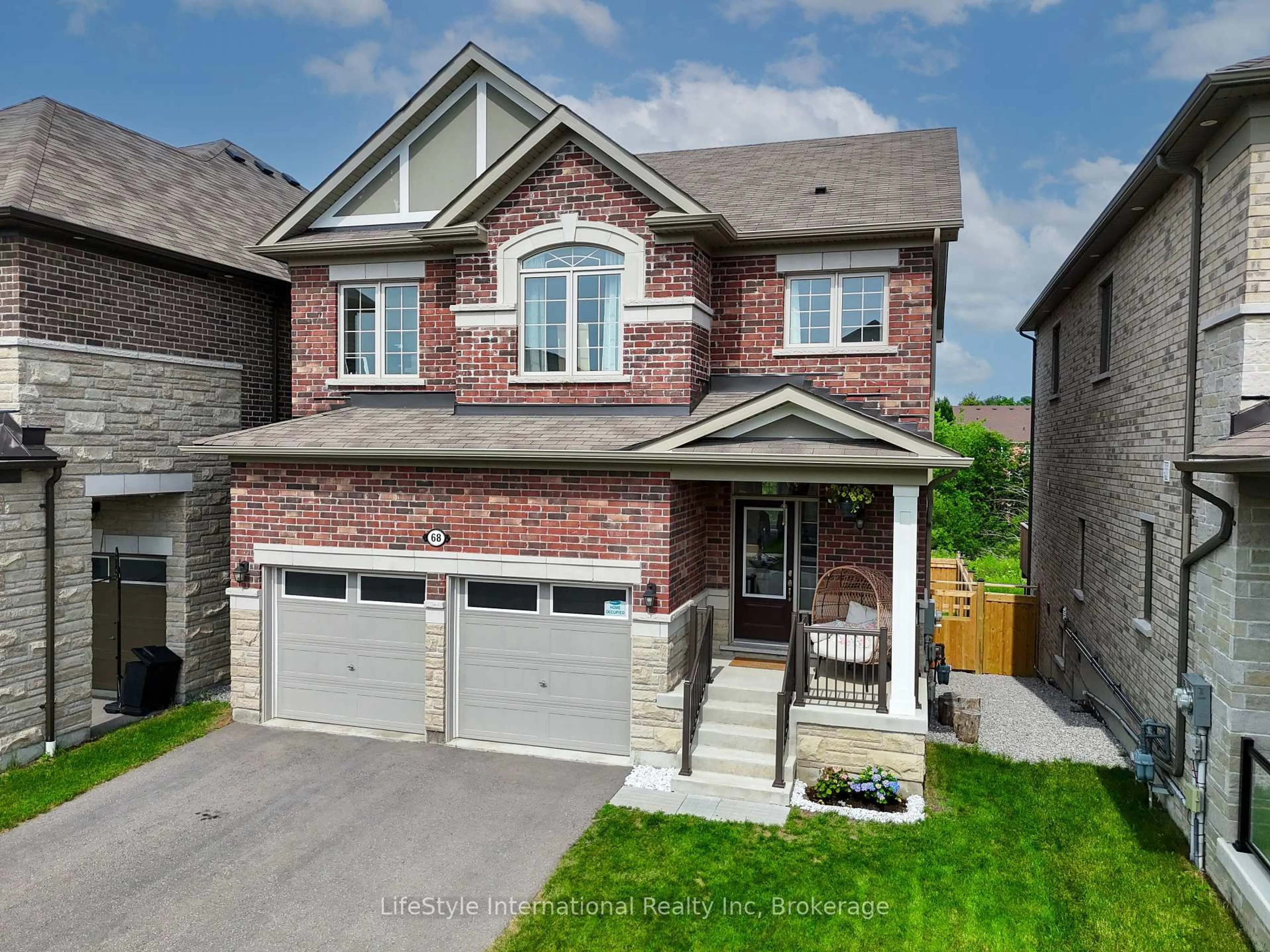 Home with brick exterior material, street for 68 Barkerville Dr, Whitby Ontario L1P 0L8