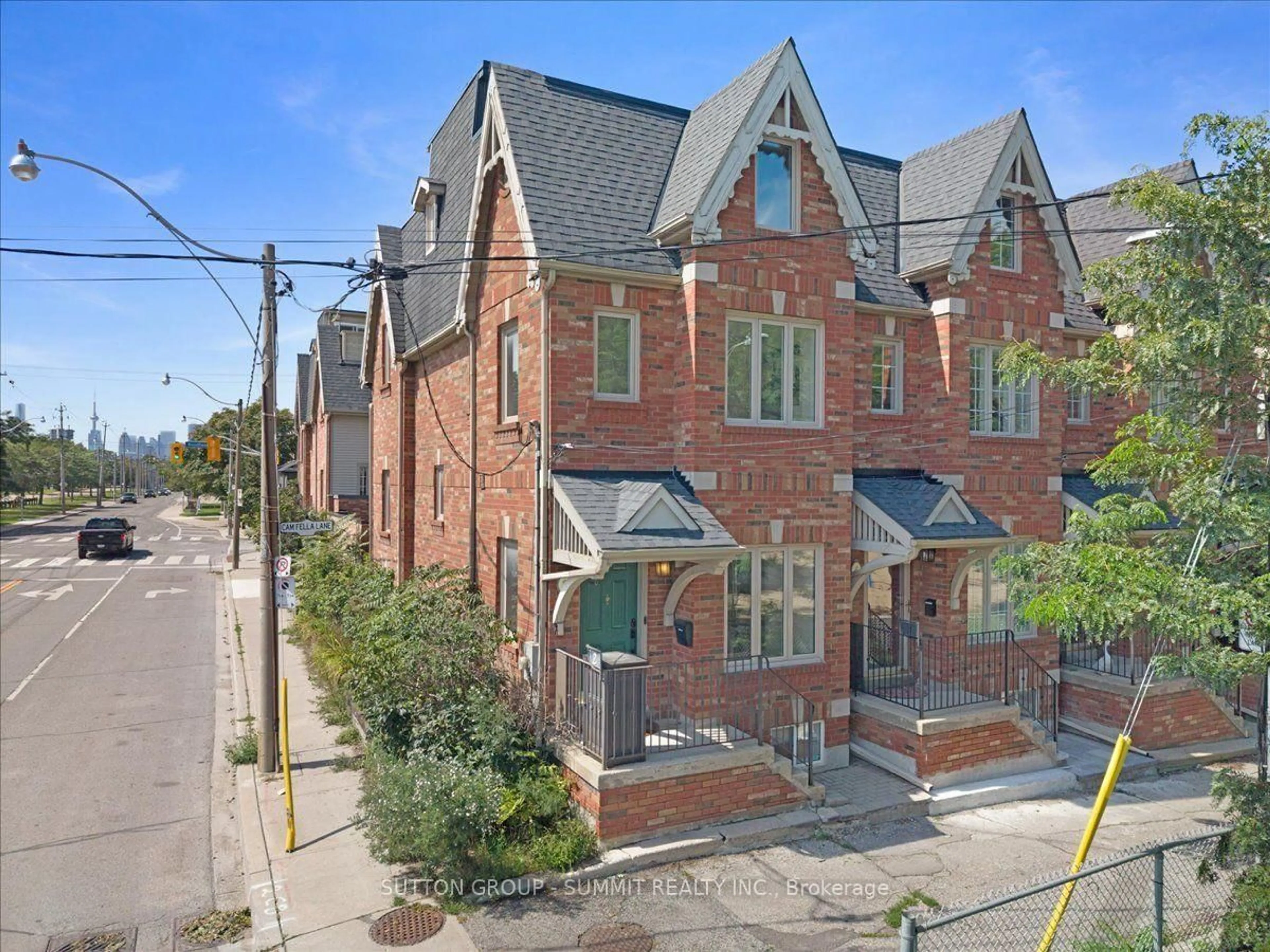 Home with brick exterior material, street for 2 Cam Fella Lane, Toronto Ontario M4L 3Z5