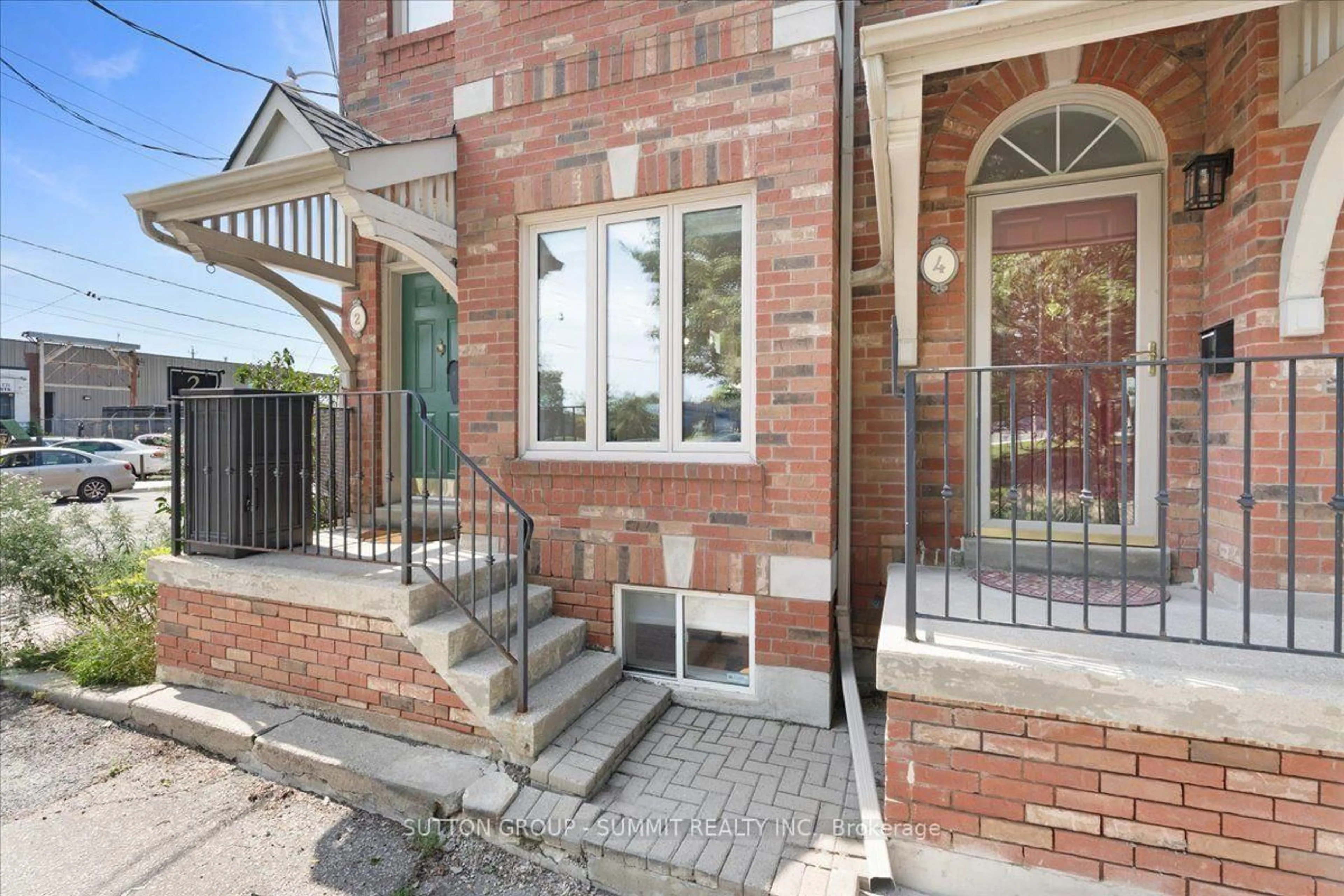 Home with brick exterior material, street for 2 Cam Fella Lane, Toronto Ontario M4L 3Z5