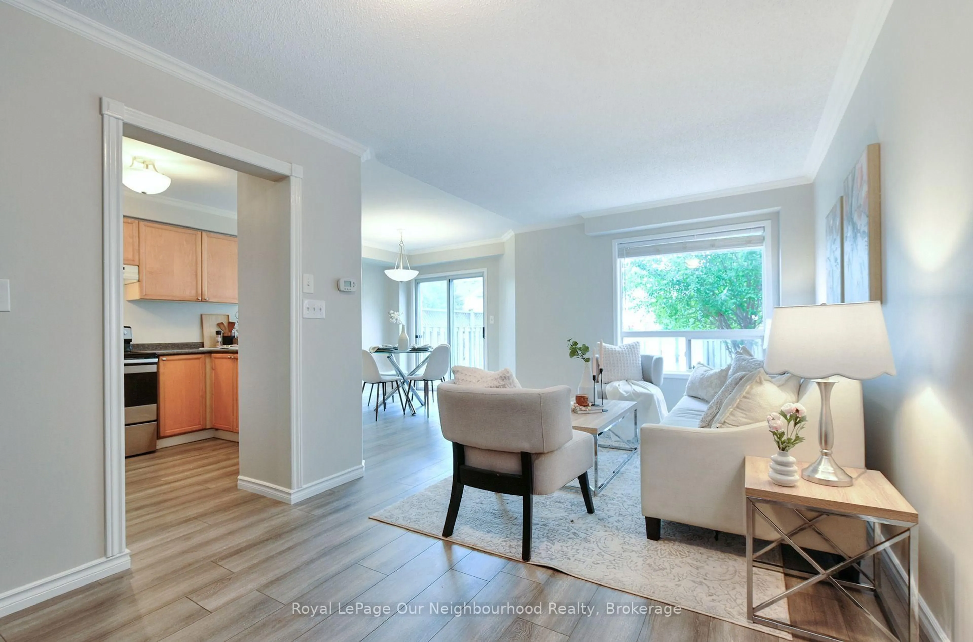 Living room with furniture, wood/laminate floor for 38 Wilkins Cres, Clarington Ontario L1E 3B8