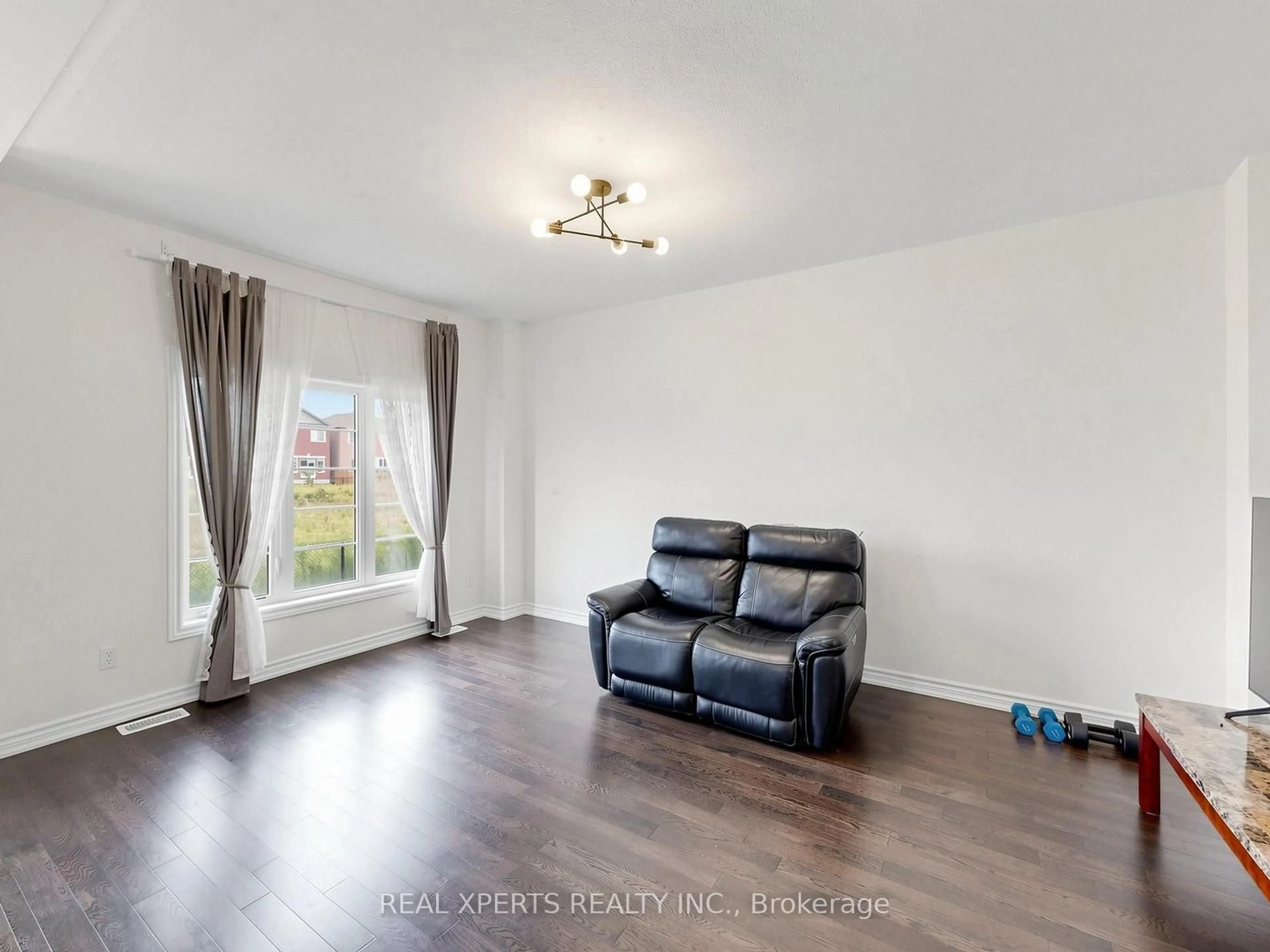 Living room with furniture, wood/laminate floor for 1129 Cameo St, Pickering Ontario L1X 0L7